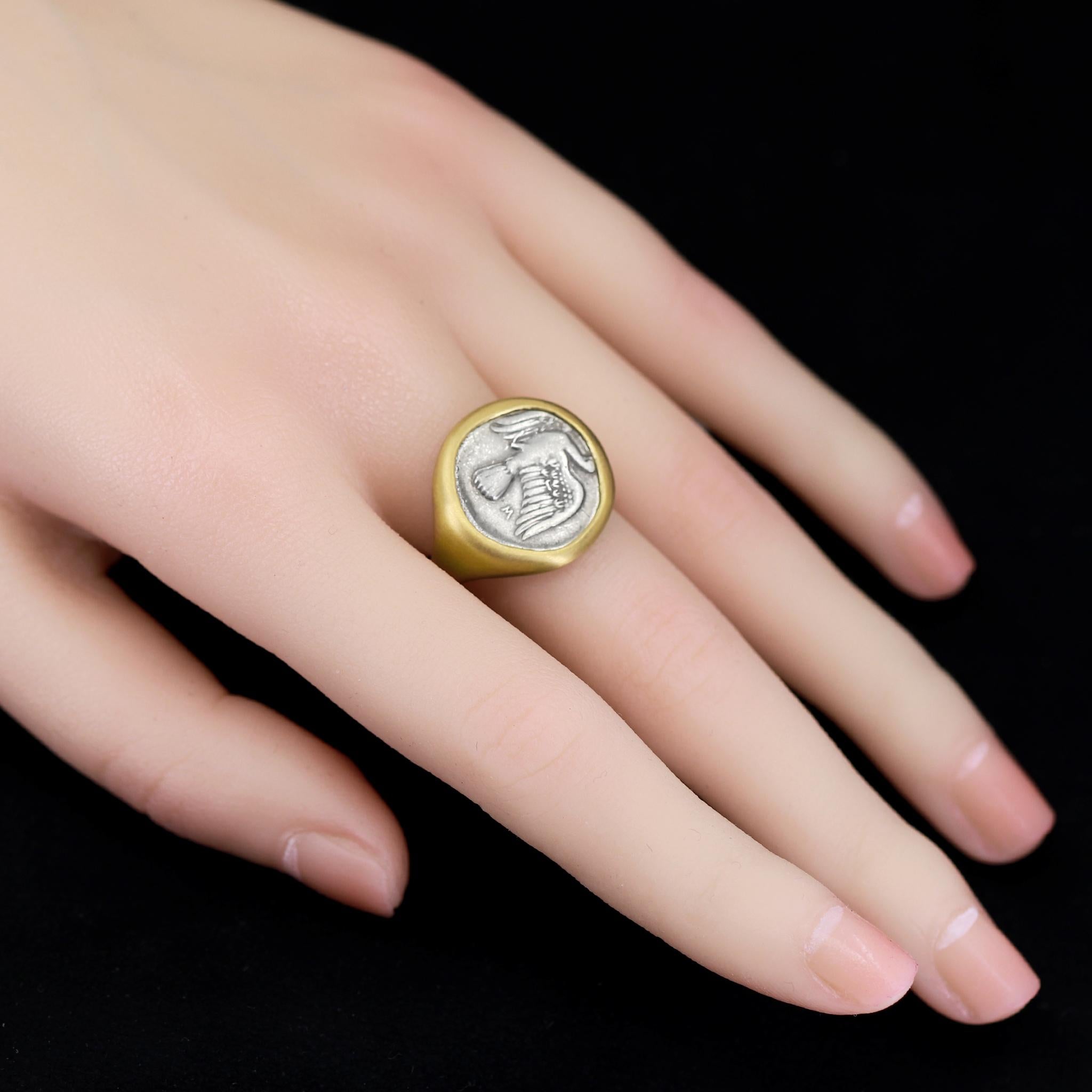 One of a Kind Ring hand-fabricated by jewelry maker Lola Brooks in signature-finished 22k yellow gold showcasing a rare, ancient Greek silver coin with a Sikyon Dove on the obverse side and a Chimera on the reverse side. The coin is in excellent