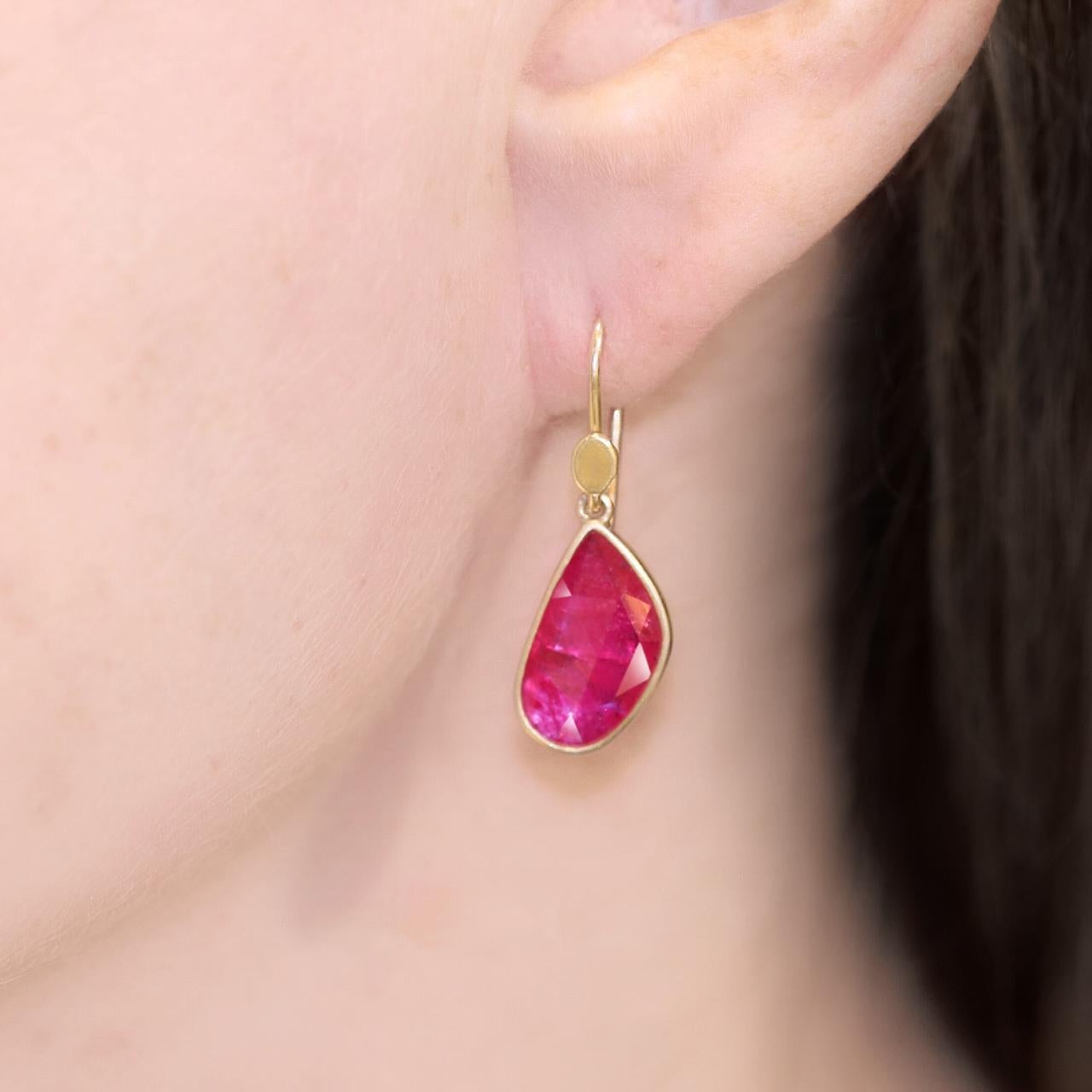 Drop Earrings hand-fabricated by jewelry maker Lola Brooks in signature-finished 18k yellow gold featuring a spectacular matched pair of shimmering rose-cut hot pink rubies totaling 4.31 carats. Stamped and Hallmarked.

About the Maker - Lola Brooks