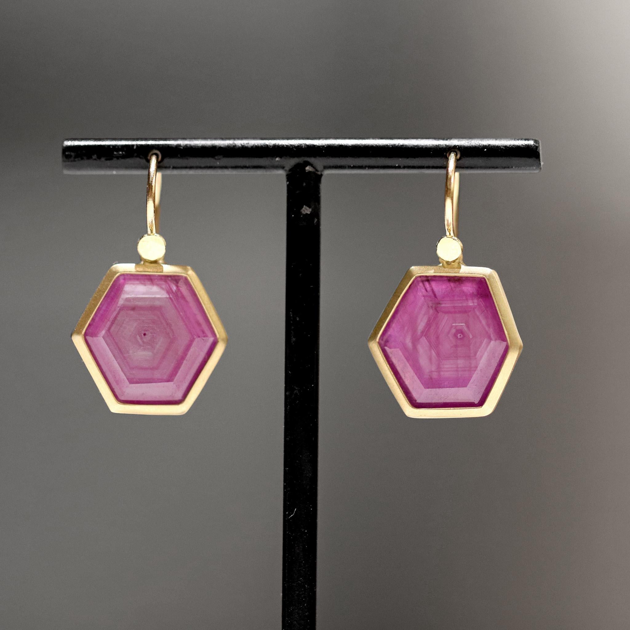 One of a Kind Drop Earrings hand-fabricated by jewelry maker Lola Brooks showcasing a stunning matched pair of natural glowing rubies that feature the hexagonal crystal growth formation only visible in completely natural stones. The gems weigh a