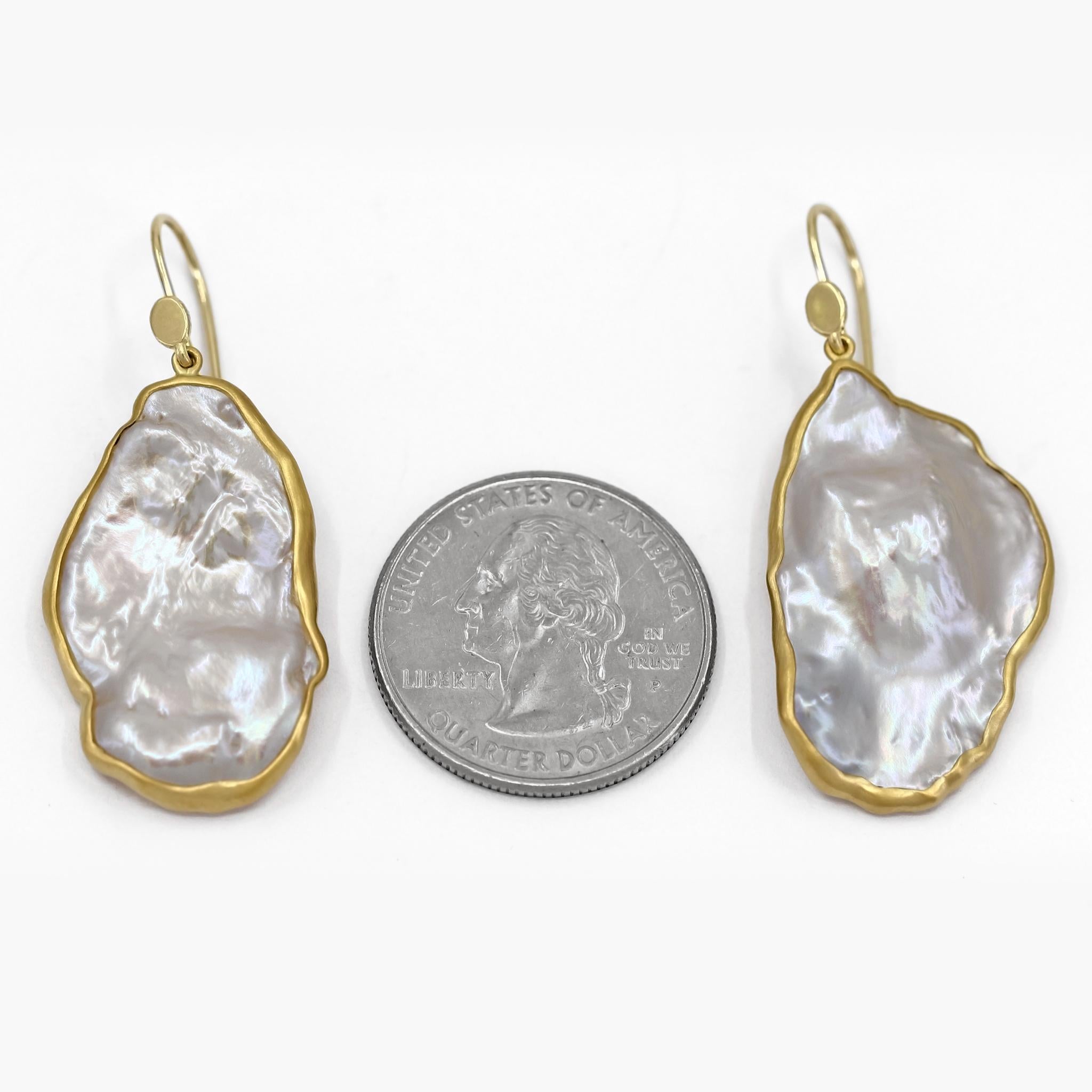 One of a Kind Drop Earrings by jewelry maker Lola Brooks hand-fabricated in 18k yellow gold featuring a remarkable matched pair of highly iridescent and incredibly lustrous white cornflake pearls, bezel-set and finished on 18k yellow gold ear wires.