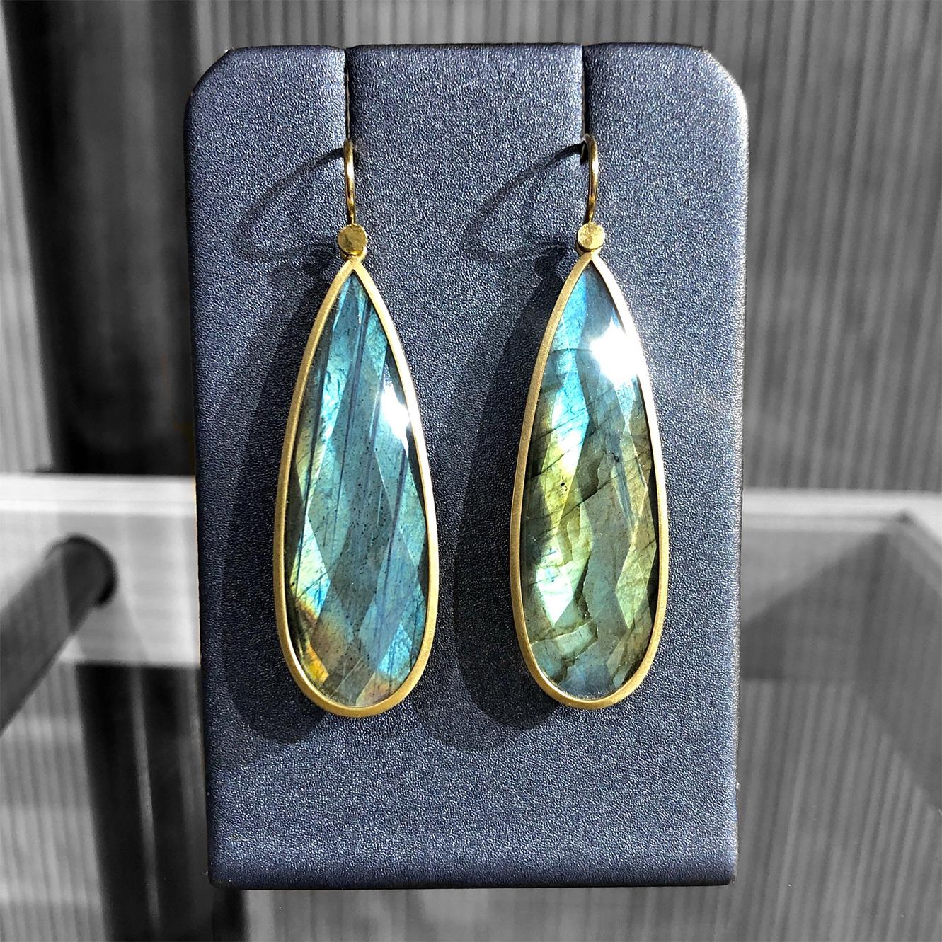 One of a Kind Drop Earrings by jewelry maker Lola Brooks hand-fabricated in matte-finished 18k yellow gold featuring a spectacular matched pair of shimmering, fiery faceted labradorite (43.39tcw), bezel-set and finished on the artist's signature