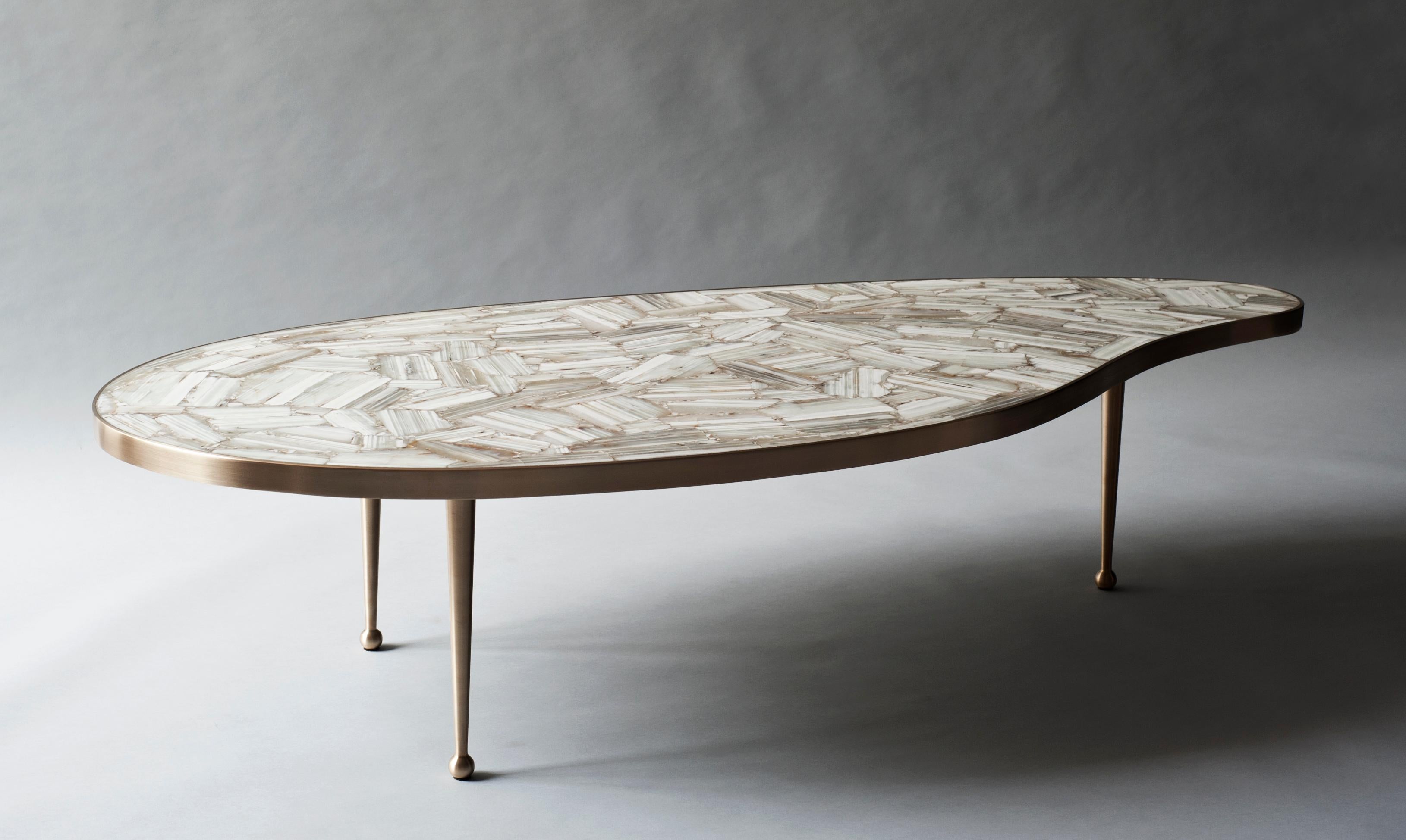 Lola coffee table by DeMuro Das
Dimensions: W 150 x D 71.5 x H 36.2 cm
Materials: agate (banded white) - polished (natural)
 Solid brass (Satin)

DeMuro Das is an international design firm and the aesthetic and cultural coalescence of its