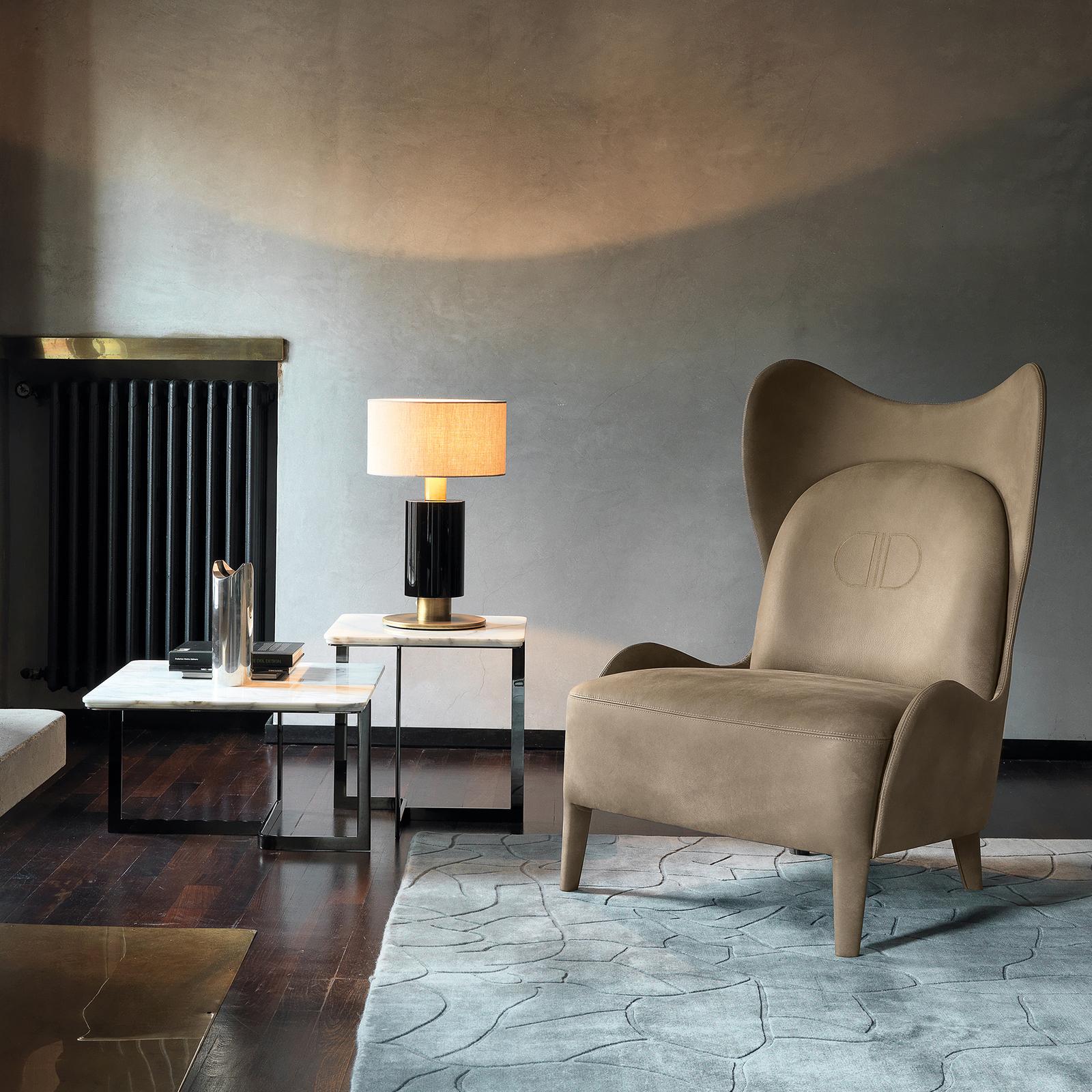The deluxe frame of the Lolita armchair is crafted from plywood and covered with rubber of varying densities, with the top layer in air soft covered by goose down for comfort. The top layer of the cushions and seat are in 3 cm memory foam and the