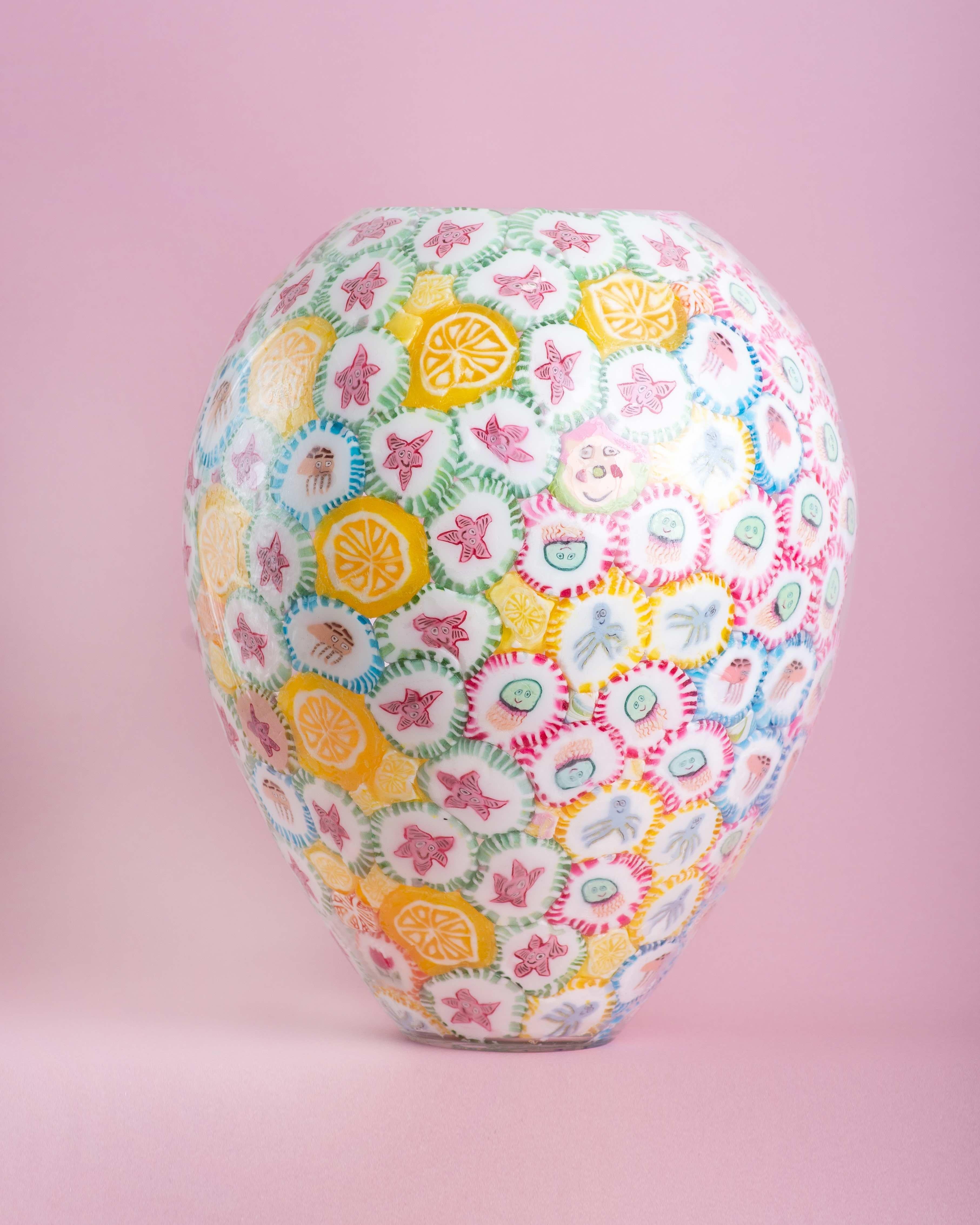 Lollipop vases are the most iconic art-pieces by Anna Jozova. It's a humorous reaction to expensive and demanding technique of Murano glass. Lollipops are glued from inside of the handblown crystal shape and later protected by clear material. All of