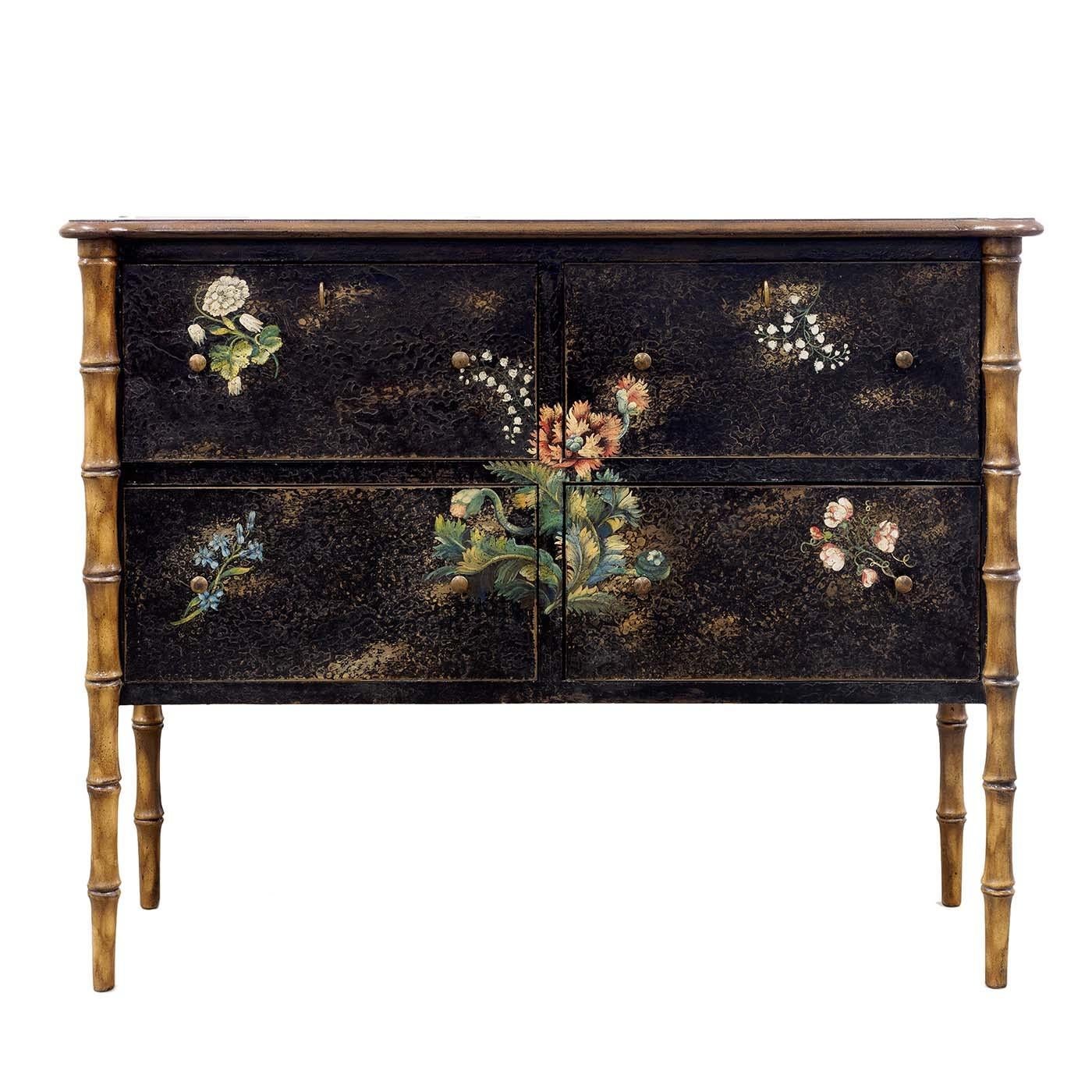The elegant Venetian style characterizes the Lombardy bedside table, custom-made and decorated entirely by hand. The wooden structure, shown here in black with decorations in soft shades, can be customized both in size and color, based on customer's