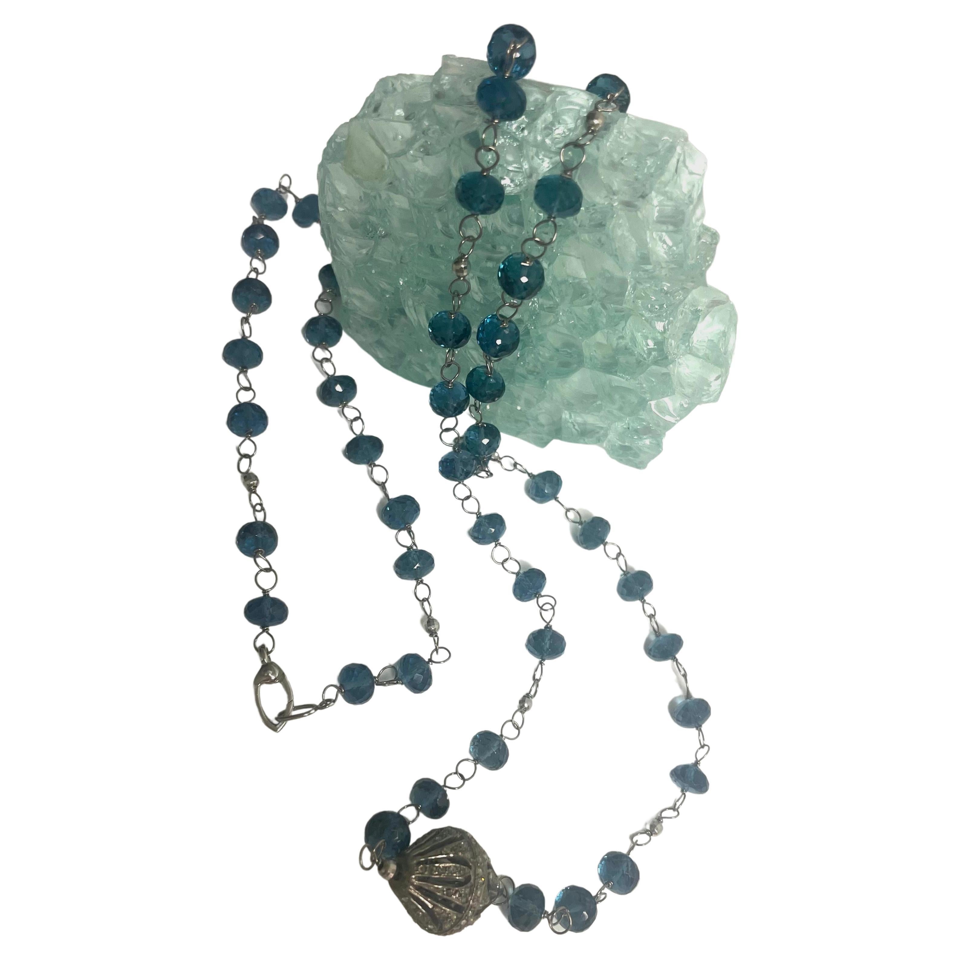 Description
The rich and exquisite London Blue color of this necklace doesn’t go unnoticed and makes a bold statement with its unusual pave diamond centerpiece. The individually wire wrapped stones and the small white gold bead accents create a