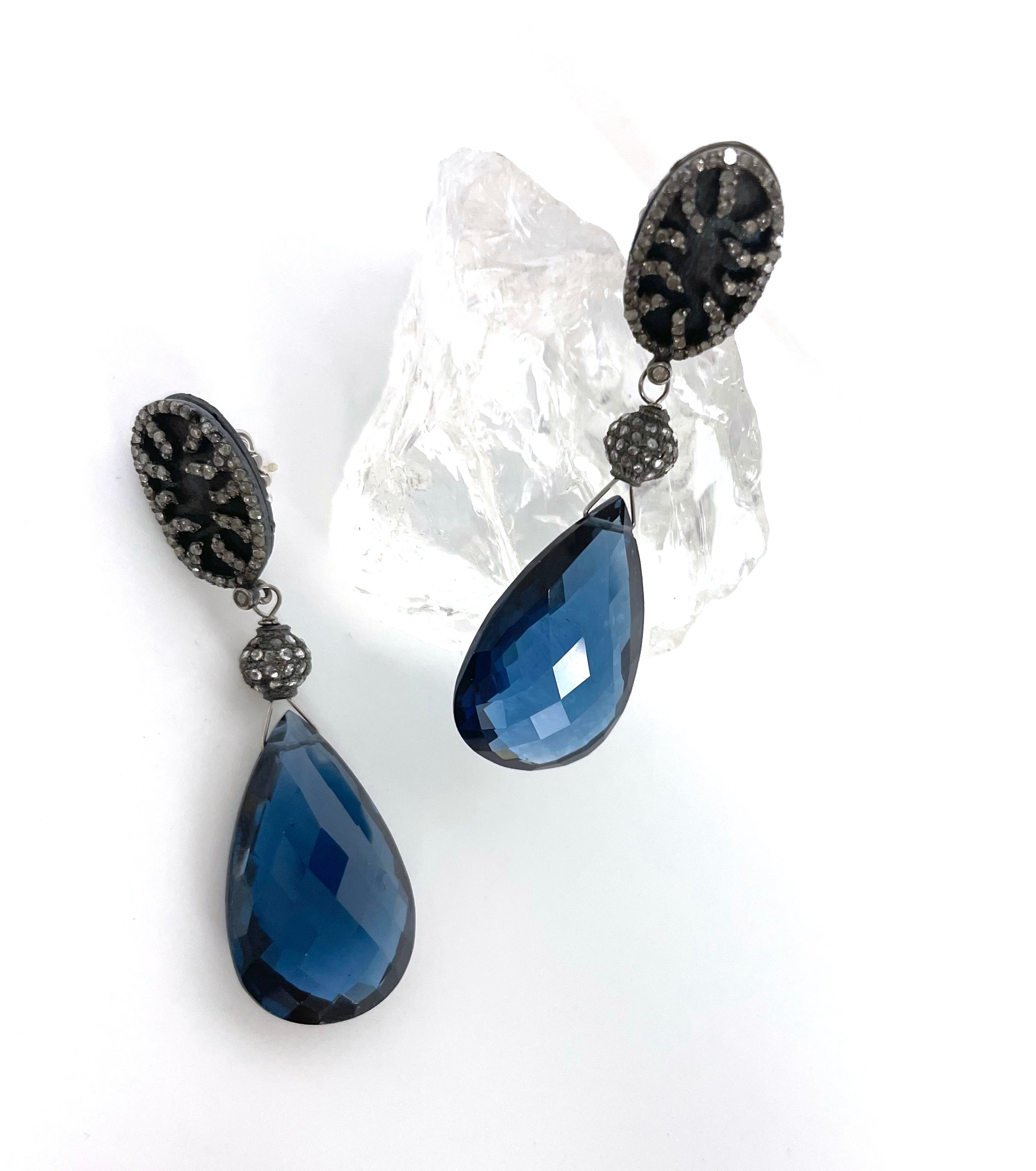 Description
The rich and exquisite color of these earrings doesn’t go unnoticed with its large teardrop London Blue quartz and Blue Titanium pave diamond studs. Item # E3210
Pair it with matching necklace (Item# N3648, short), matching bracelet