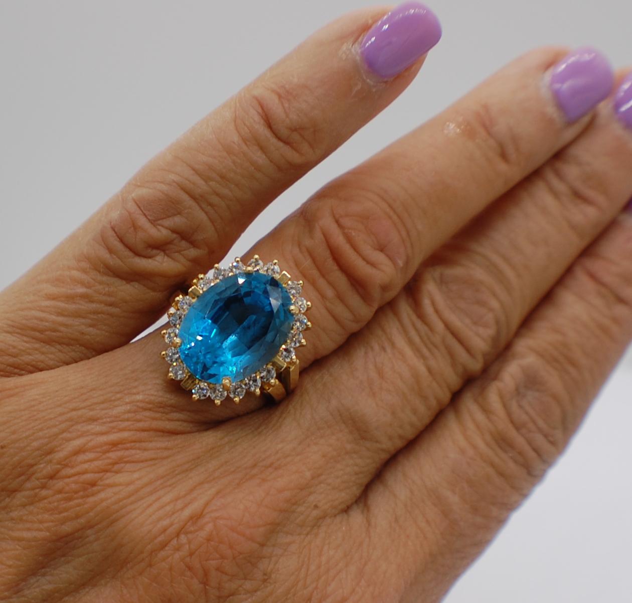 Oval Cut London Blue Topaz and 1 Carat Diamond Halo Ring 18 Karat Yellow Gold