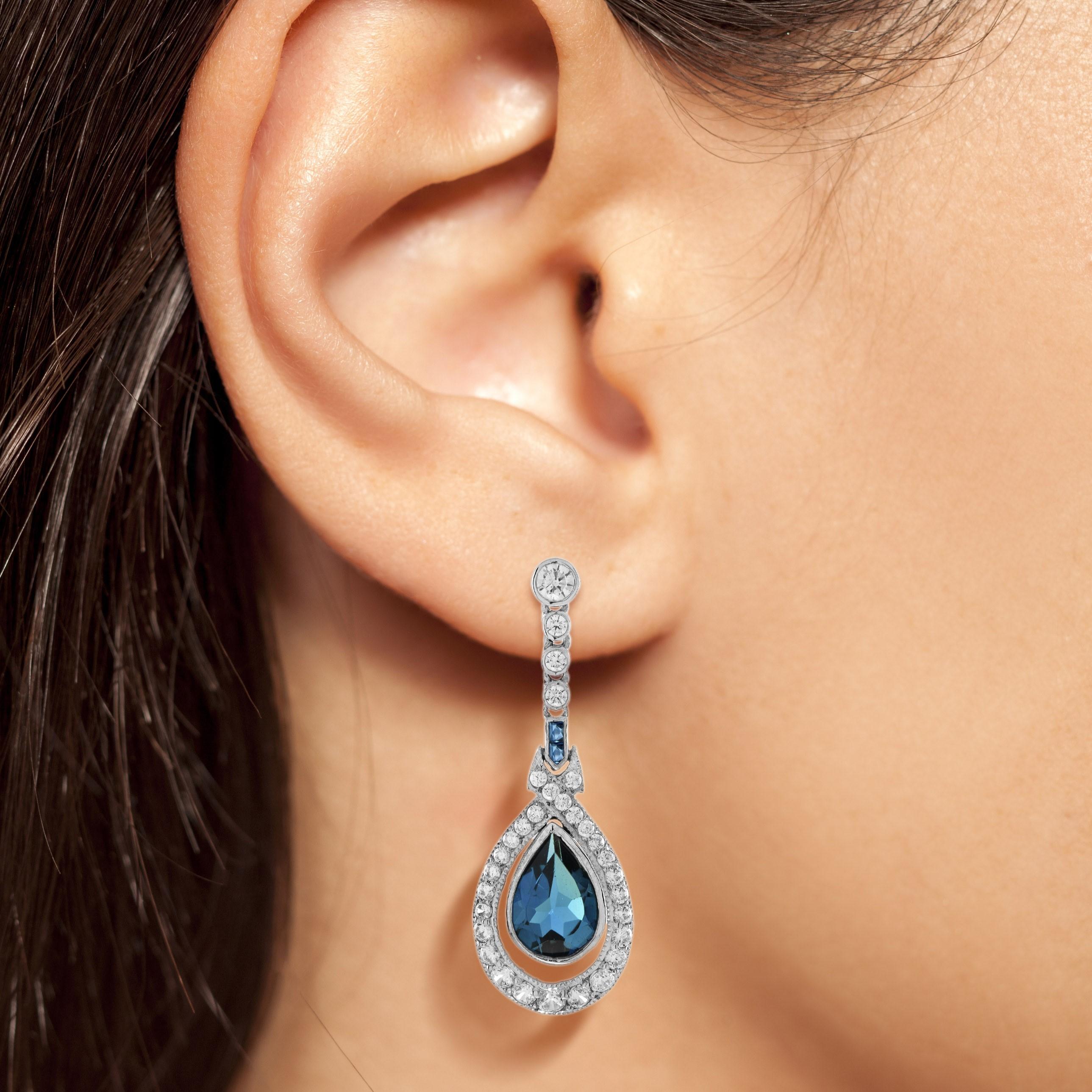 These gorgeous classic antique design earrings are absolutely captivating. The rich, even color of the pear shaped London blue topaz accented by the diamonds would make a wonderful gift for a December or November birthday, just anyone that simply