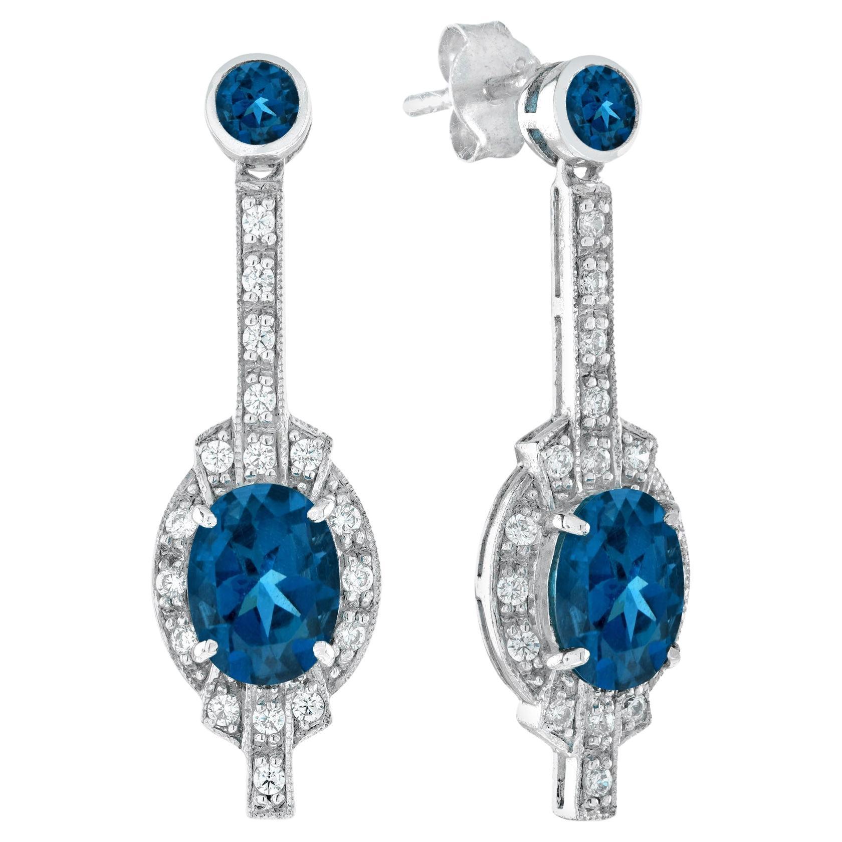 Boucles d'oreilles pendantes de style Art déco en or blanc 18 carats, topaze bleue de Londres et diamants en vente