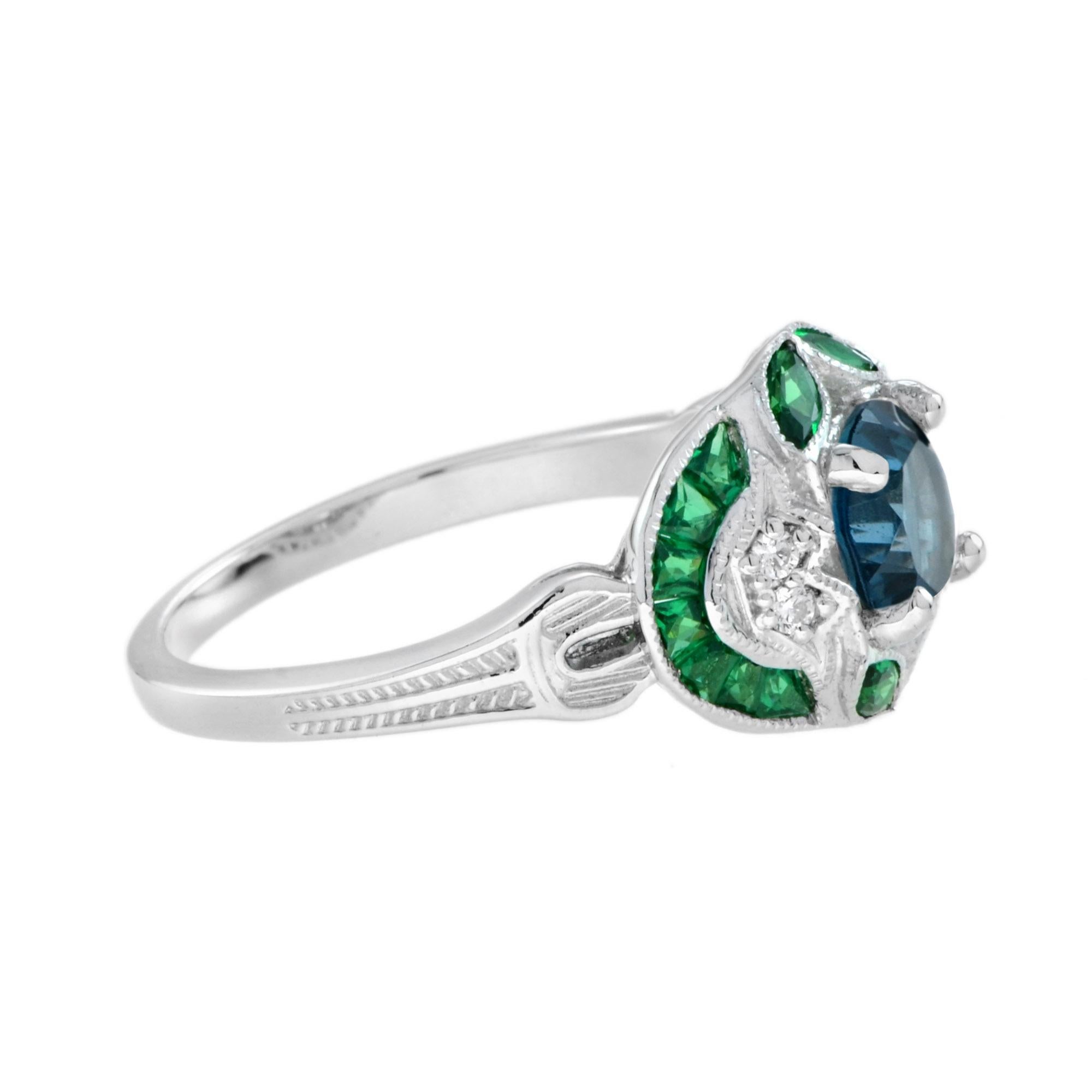 Charming Art Deco style ring featuring a London blue topaz center surrounded by French cut emerald and diamonds in 18k white gold. Designed perfectly for everyday wear, this beautiful piece would make the perfect engagement or dress ring. 

Ring