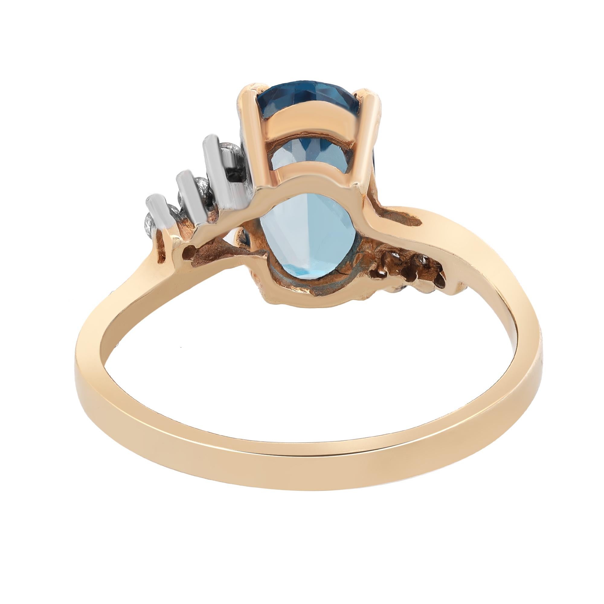 This gorgeous ladies ring is crafted in 14k yellow gold. Features prong set oval cut london blue topaz weighing 1.73 carats with 6 sparkling round cut diamonds. Ring size 7.25. Total weight: 3.00 grams. Comes with a presentable gift box.
