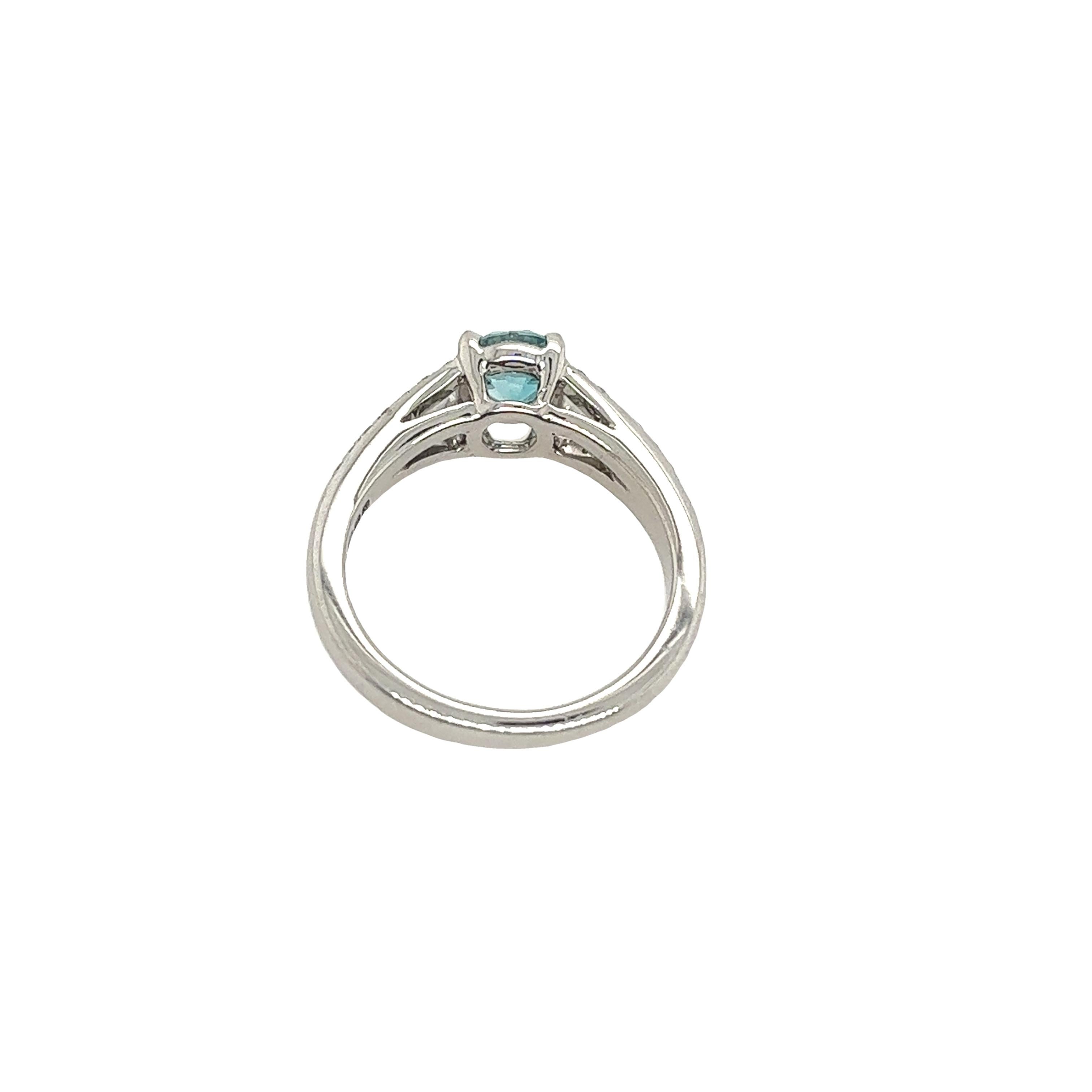 Classic fine quality London blue topaz ring with 28 round brilliant cut diamonds on the shoulders, total diamond weight is 0.14ct set in exquisite 18ct white gold.

Total Weight: 4.3g
Ring Size: I1/2
Width of Band: 2.13mm
Width of Head: