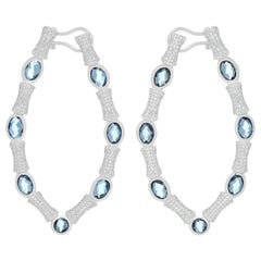 Pendientes de oro blanco de 14 quilates con tachuelas de diamantes y topacio azul de Londres