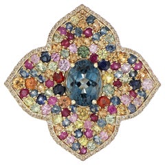 Anello tempestato di topazio blu di Londra e zaffiri multipli in oro giallo 10 carati