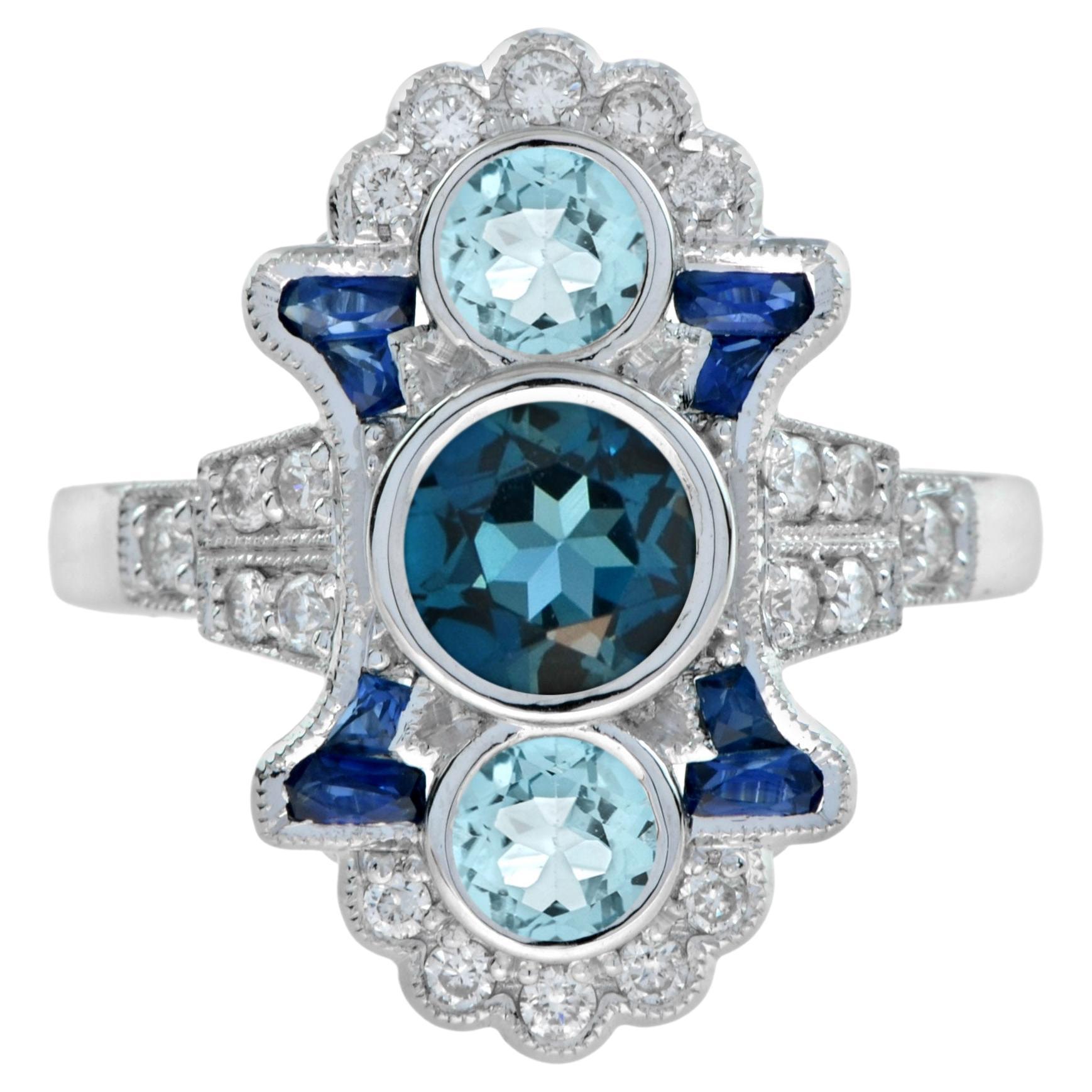 For Sale:  London Blue Topaz Aquamarine Sapphire and Diamond Three Stone Ring in 18k Gold