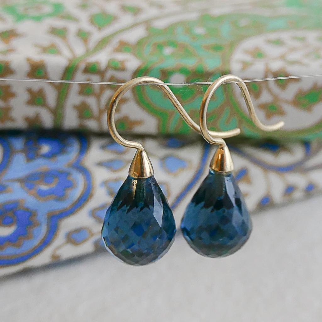 ✦✦ Faceted 10x13mm London Blue Topaz is set in 14kt solid yellow gold earwires. 
✦✦ Length of earrings is 2.5cm. 