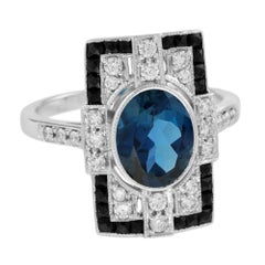 Bague en or blanc 14 carats, topaze bleue de Londres, diamant et onyx noir de style Art déco