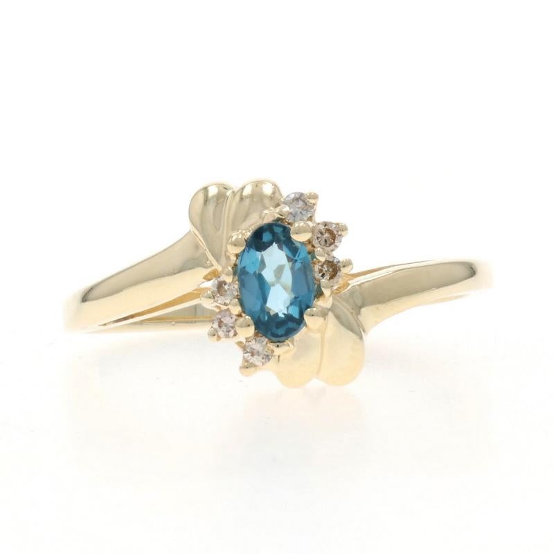 London Blue Topaz Diamond Bypass Ring - Oval .32ctw For Sale