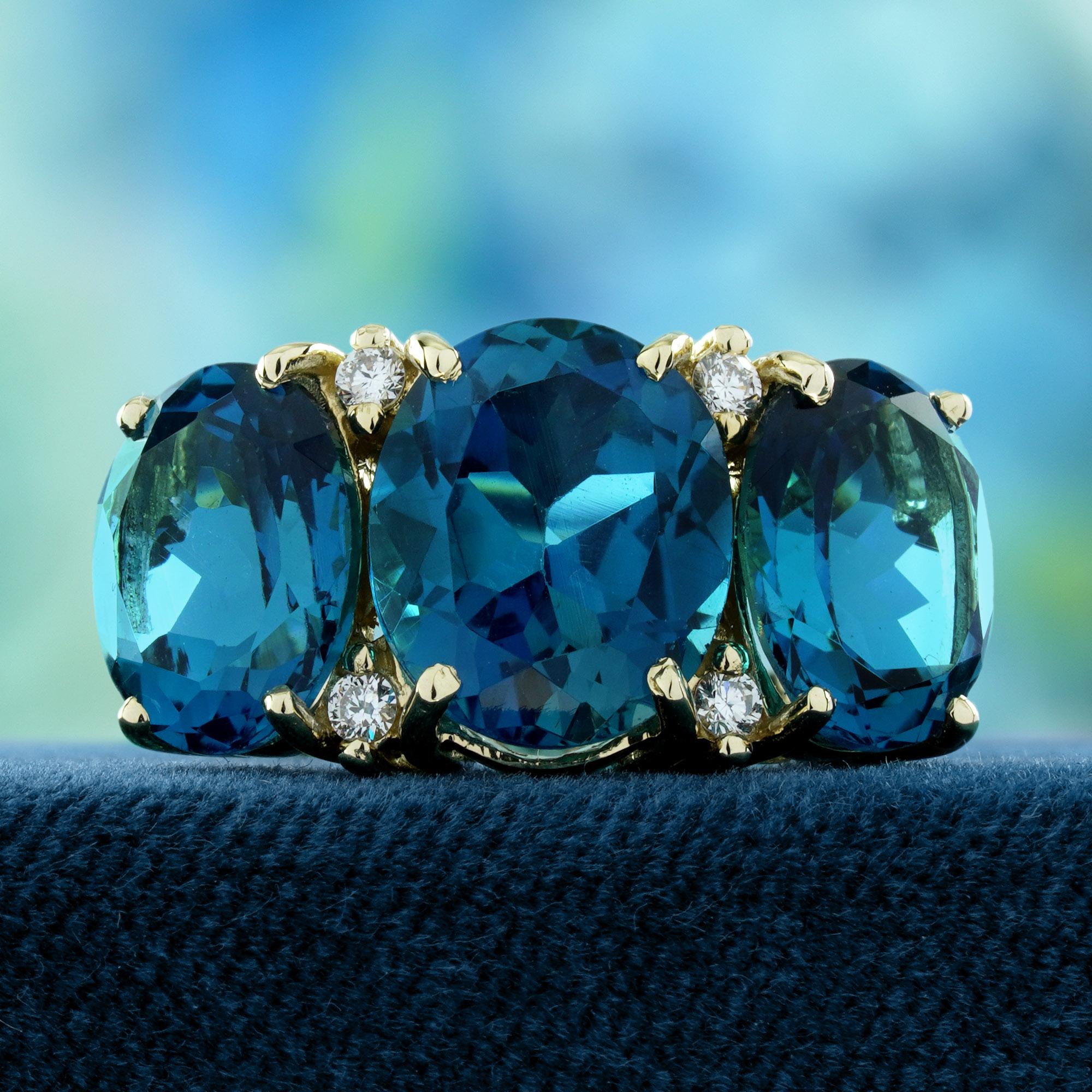 Features three striking London Blue Topaz stones, elegantly spaced with sparkling diamonds in between each stone. The rich blue hues of the topaz, paired with the radiant diamonds, create a sophisticated and timeless design. Perfect for those who
