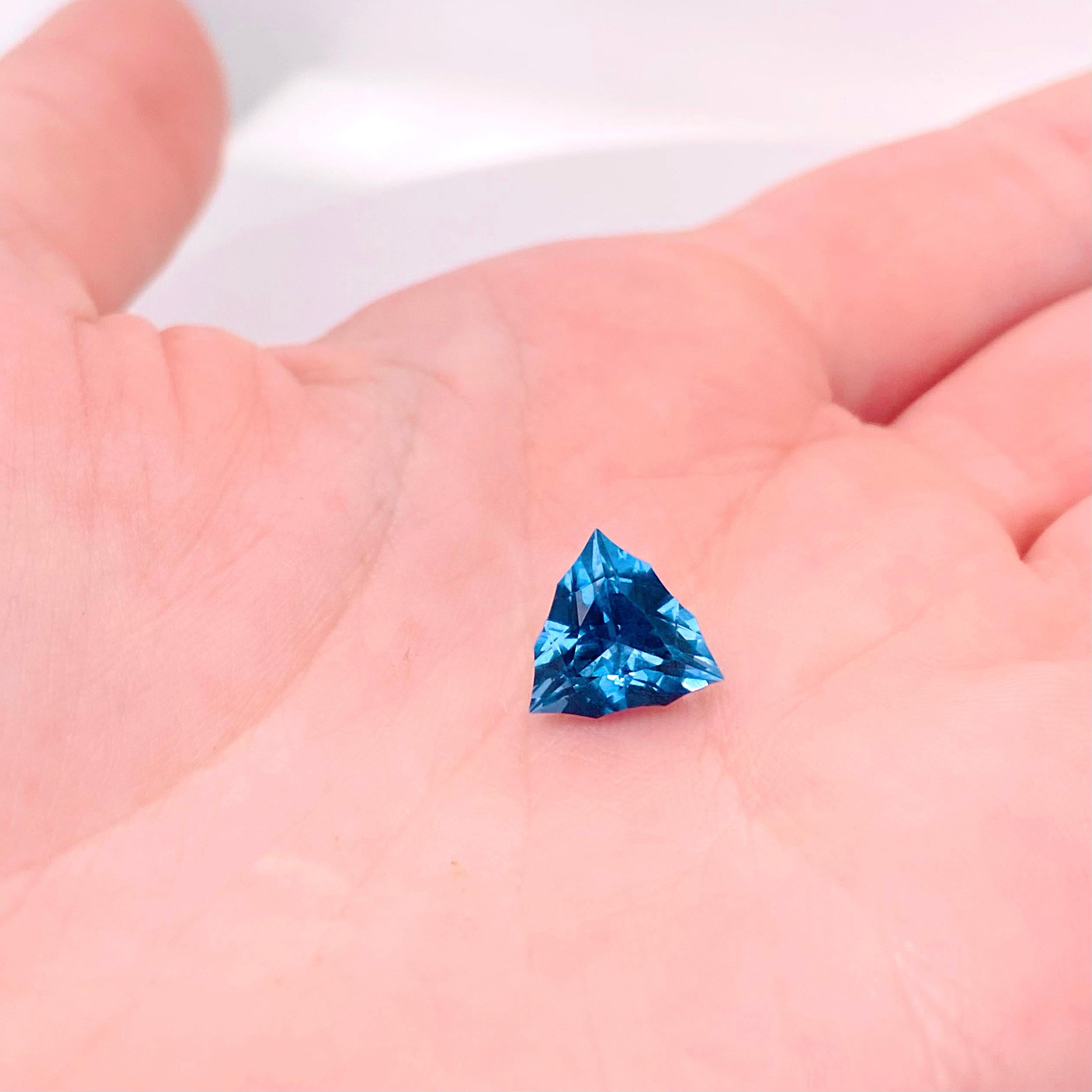 This Brazilian Fantasy Gemstone weighs 3.81 carats and was very carefully cut by a well known cutter in Brazil. The London Blue Topaz is so sleek and has amazing reflections. The color of the topaz is a gorgeous deep, vibrant color and the sleek