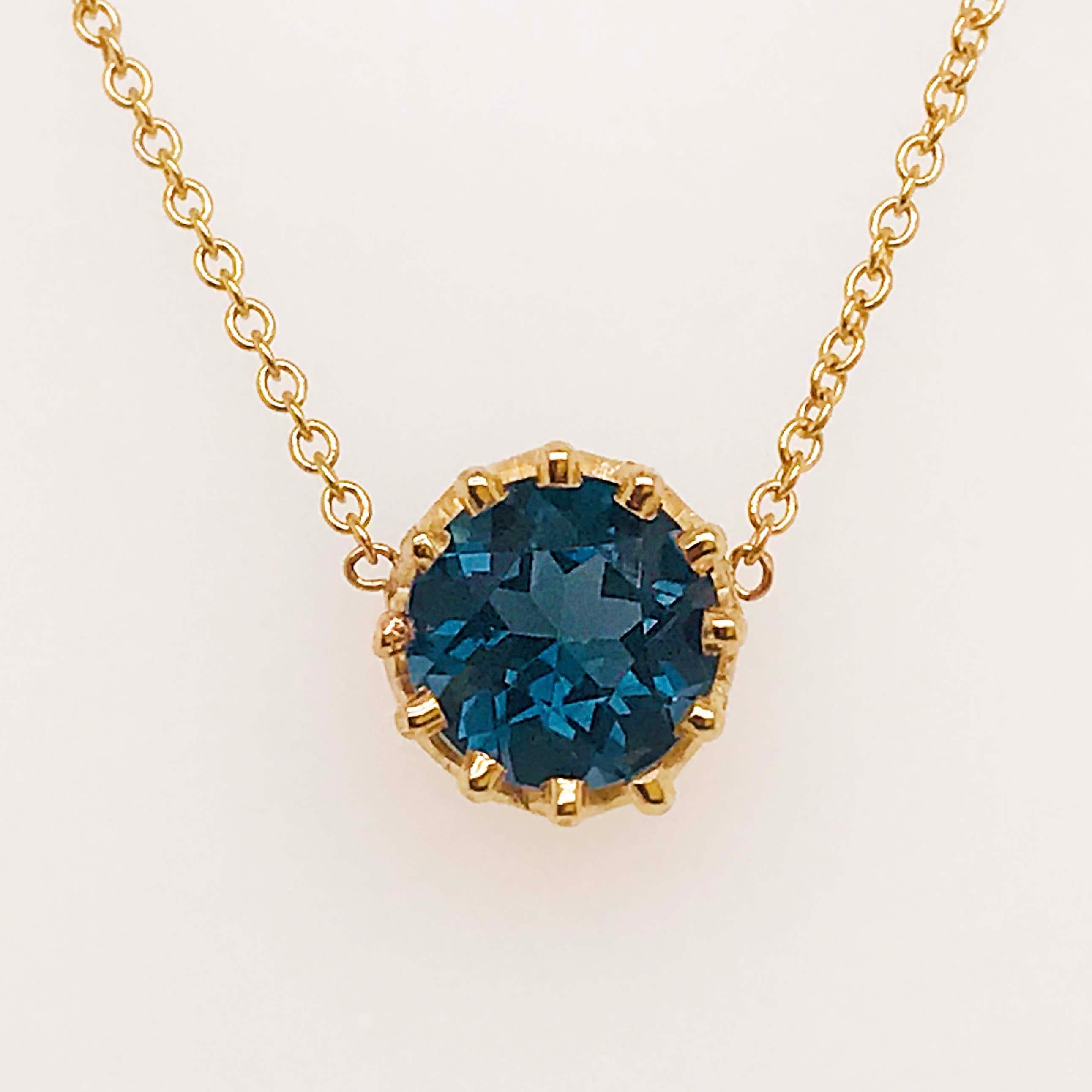 This 1.75 carat London Blue topaz gemstone necklace is a statement piece. With a genuine round London blue topaz gemstone set in the center. The topaz gemstone has been cut in a round faceted shape that radiates brilliance and showcased the gorgeous