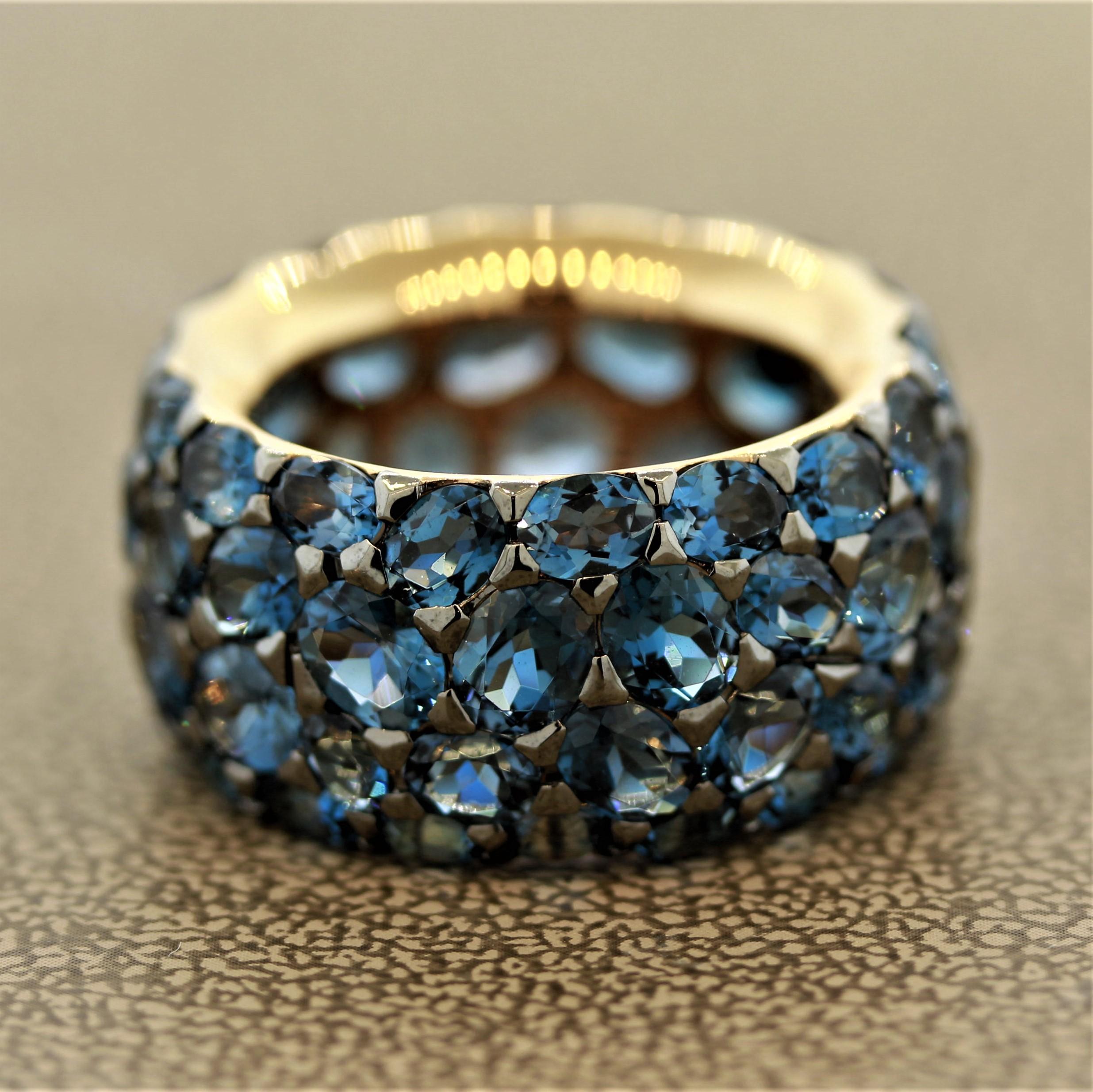 A “comfort fit” eternity band that fits smoothly and feels great being worn. It features 16.38 carats of London blue topaz with its famous deep blue color in oval shapes of different sizes. Made in 18k rose gold.

Ring Size 6.5