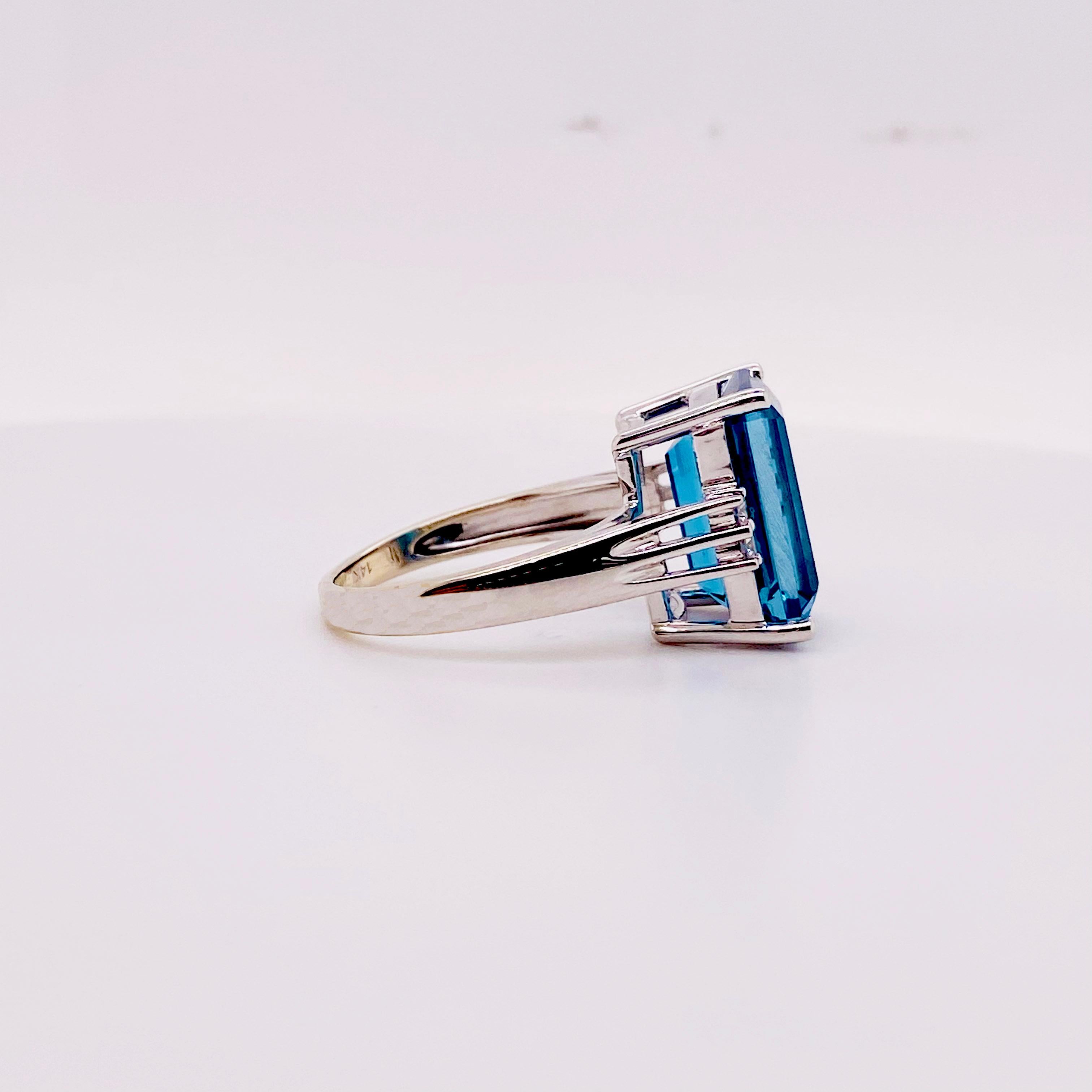 This sexy Royal Blue Topaz is a five stone ring that is gorgeous on any finger! The diamonds and gemstone are securely set with prongs. The ring looks great as a ring finger ring or a middle or pointer finger ring.
The details for this beautiful