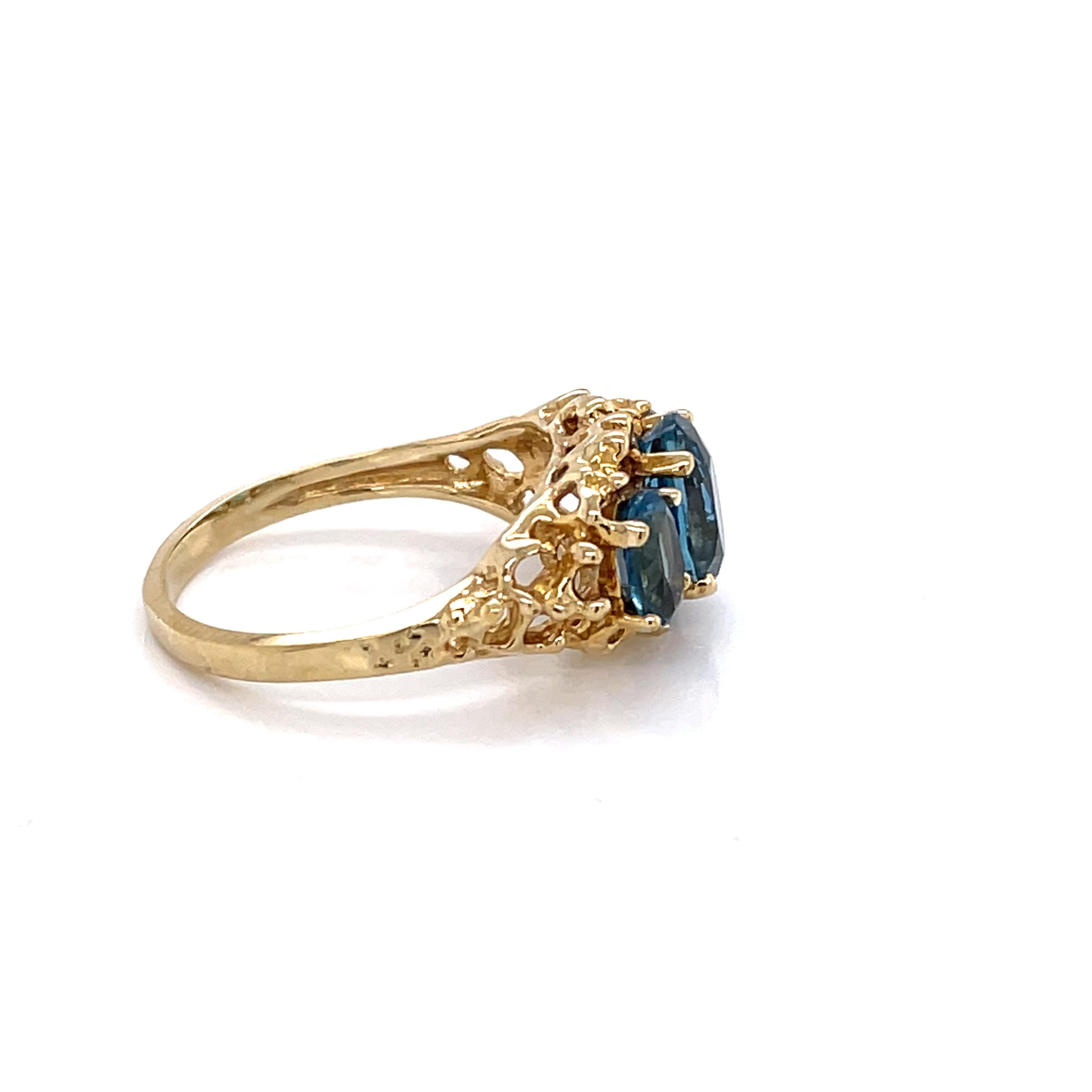 London Blue Topaz Three Stone 10 Karat Yellow Gold Ring In Excellent Condition In Mount Kisco, NY