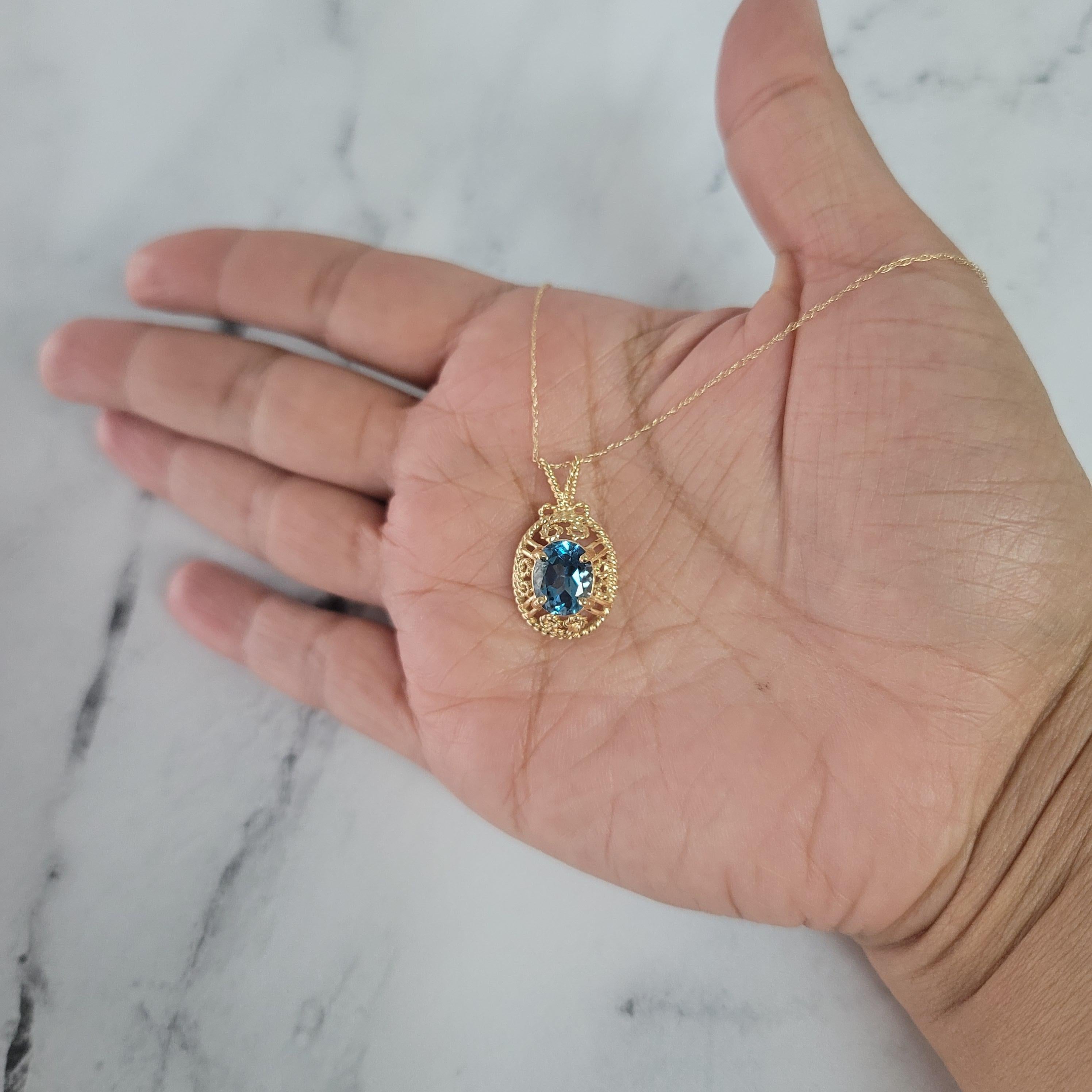 Oval Cut London Blue Topaz with Rope Design Necklace 14k Yellow Gold For Sale