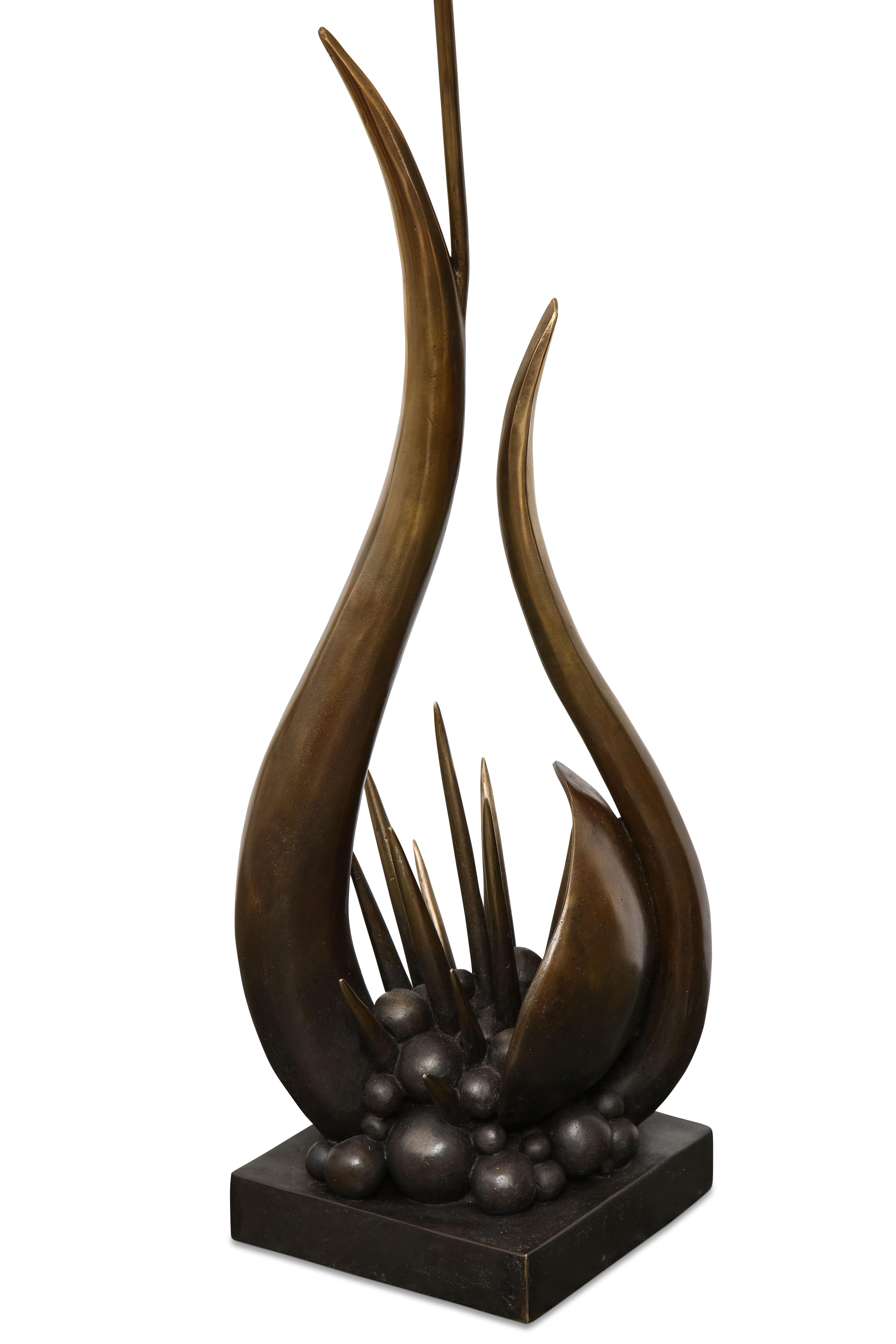 An abstract sculpture as a lamp in patinated bronze
Artist proof.