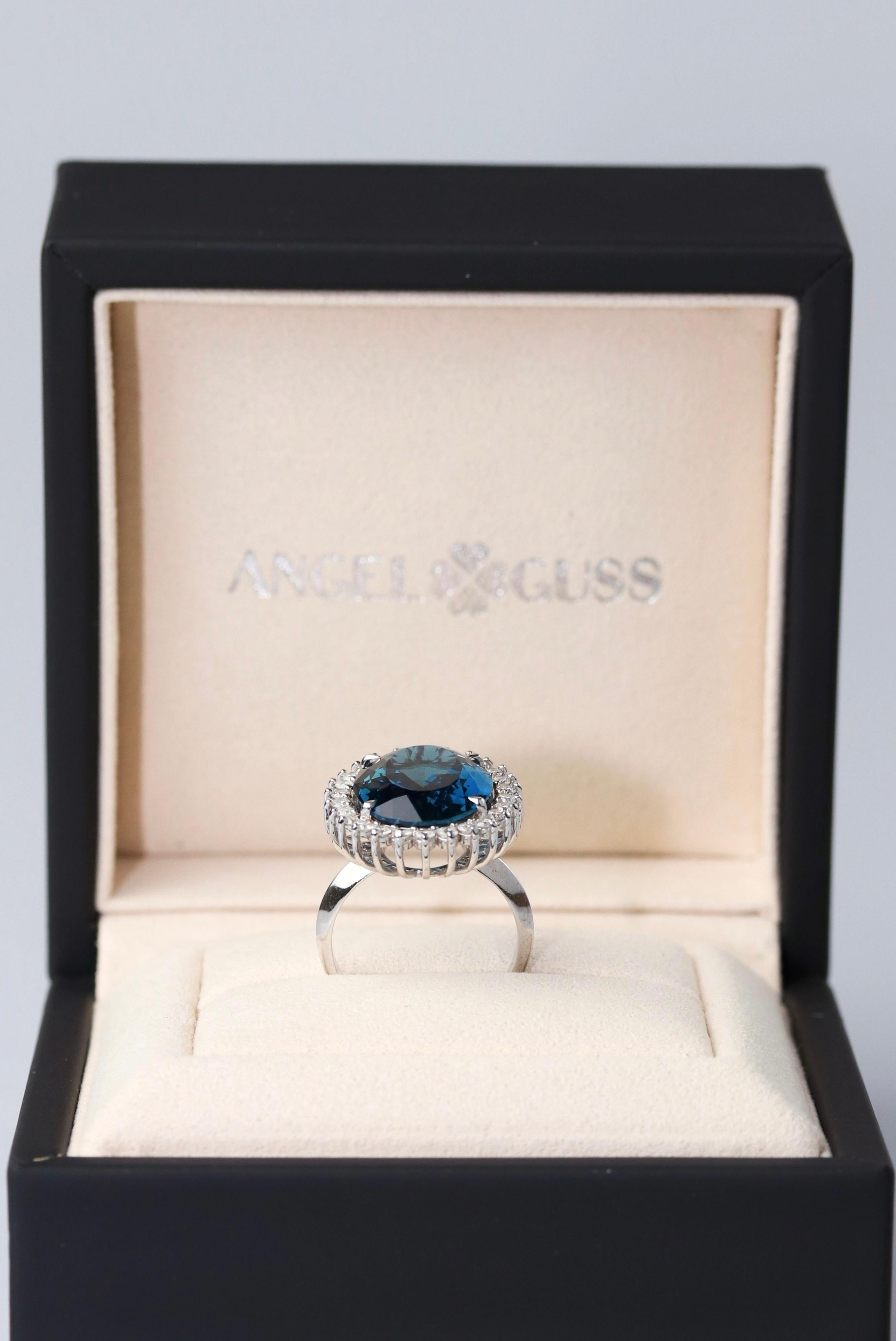 18K Solid White Gold

Natural Diamonds

Natural London Swiss Topaz Gemstone: Oval shape, Size 14,8 x 19,6mm


This beautiful ring draws inspiration from the timeless elegance of Princess Diana's iconic piece. At its heart lies a dazzling London
