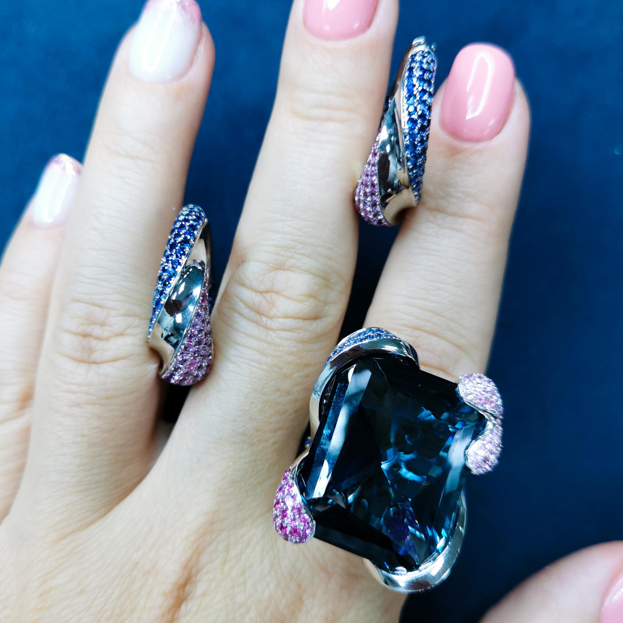 London Topaz Pink Blue Sapphires 18 Karat White Gold New Age Suite
Look at this spectacular London Topaz 41.79 Ct, Pink Sapphires, and Blue Sapphires combination. This gleaming ensemble creates a feeling of love and passion. White 18 Karat Gold