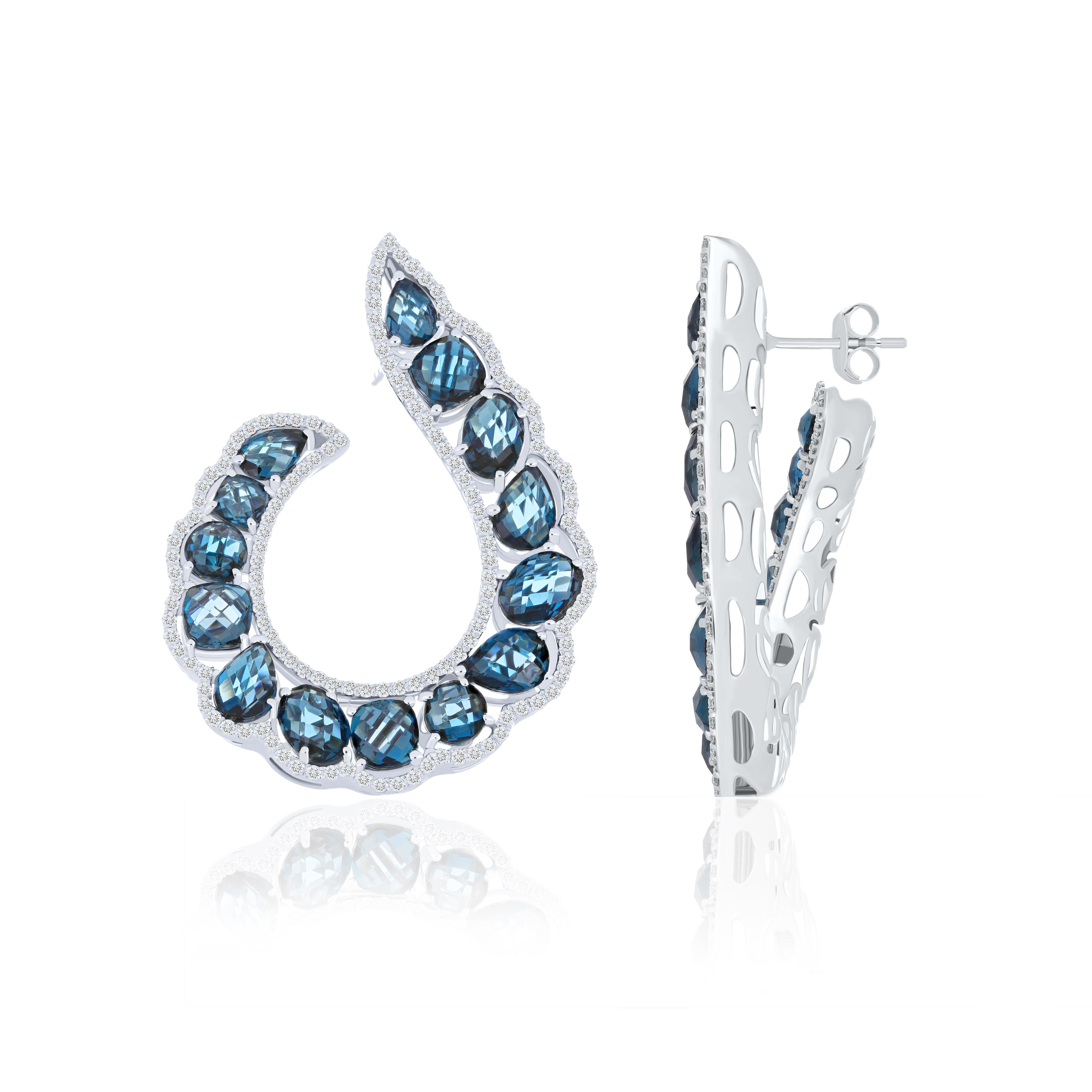 Elegant and Exquisitely detailed White Gold earrings, set with 19.00 CT's. (total approx.) beautiful and vibrant London Blue Topaz accented with micro pave Diamonds, weighing approx. 1.95 cts. (approx.). total carat weight. Beautifully Hand-Crafted