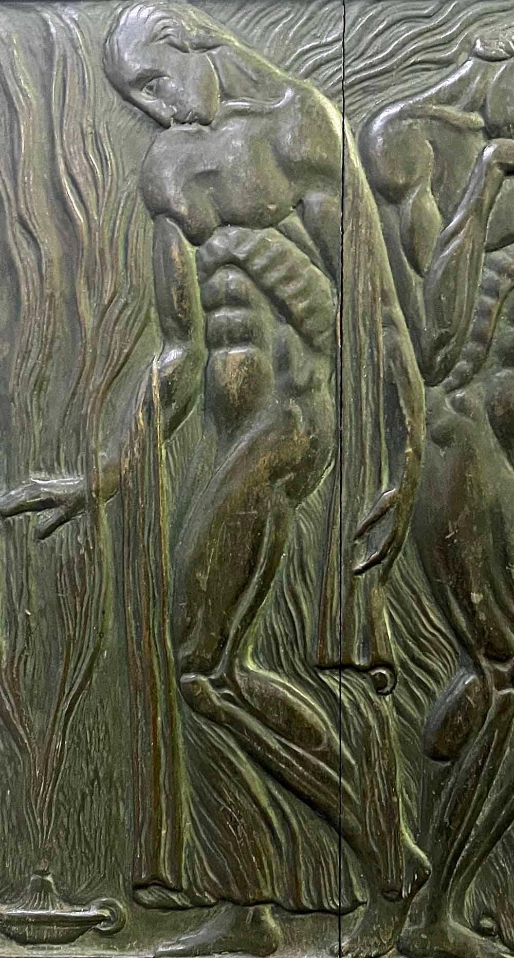 Quite extraordinary in concept and execution, this carved wood relief panel by one of Argentina's leading sculptors in the early 20th century depicts four nude male figures consoling each other and bathing in the rising smoke from an oil lamp on the