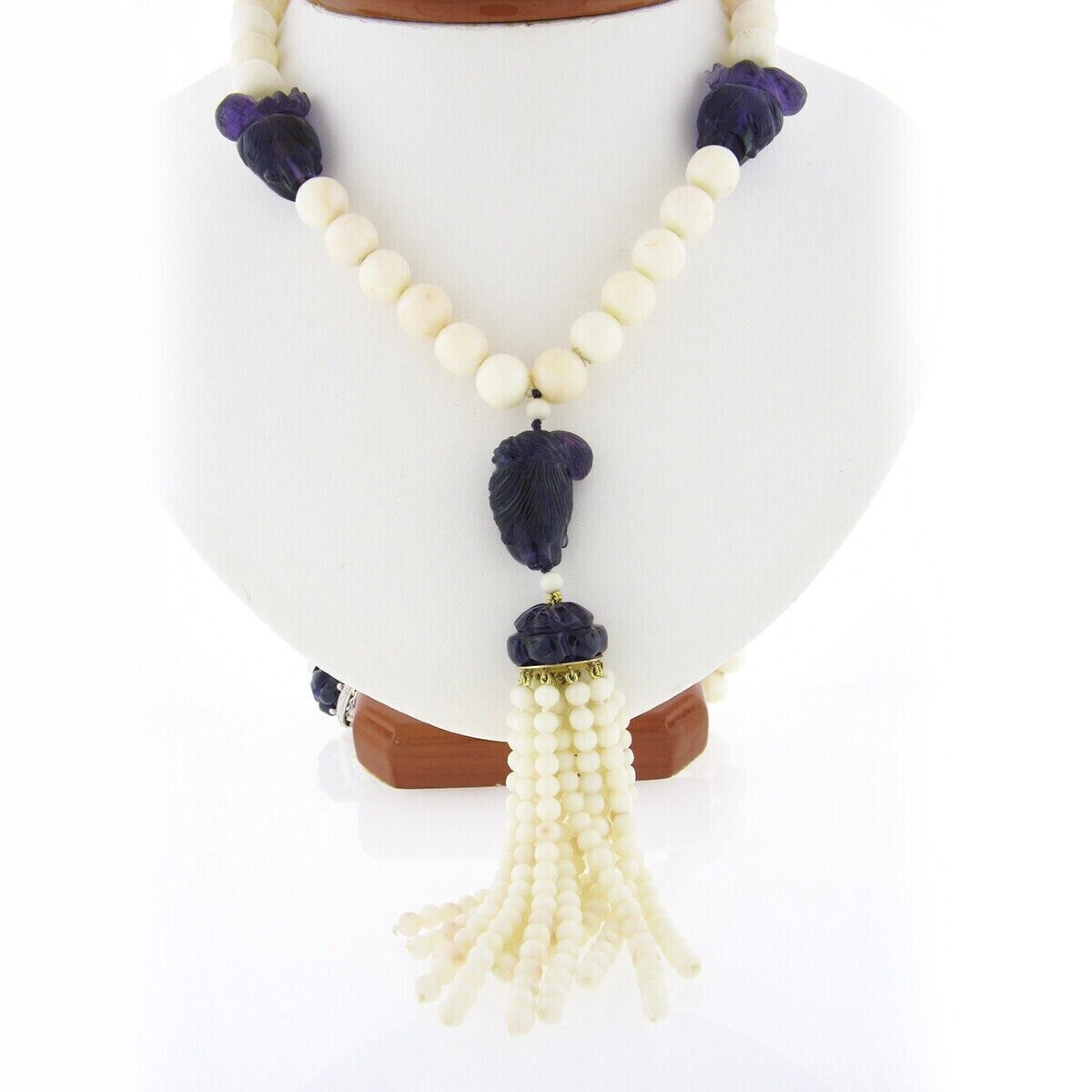 Here we have an absolutely magnificent, long, vintage angel skin coral bead strand necklace that features incredible carved amethyst stones neatly stationed throughout. Three round angel skin coral beads have been randomly selected and certified by
