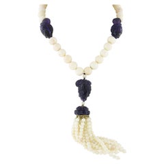 Collana lunga di corallo pelle d'angelo GIA in oro 14k con testa e nappina di ametista intagliata