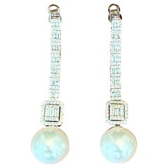 Orecchini a goccia lunghi in oro bianco 18 K. con diamanti dei mari del Sud