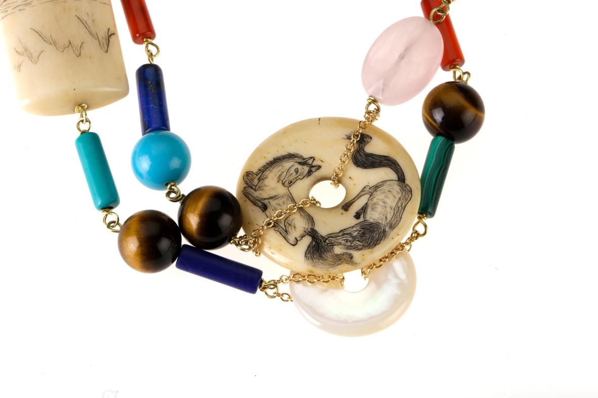 Long 18kt gold necklace gr.20,20, with many antiques Chinese pieces like jade, carnelian,  turquoise, lapis.... and very rare netsuke. You can where in a single o multi stand as you like. Total length 1,03 Mt you con make a lot of round on your neck