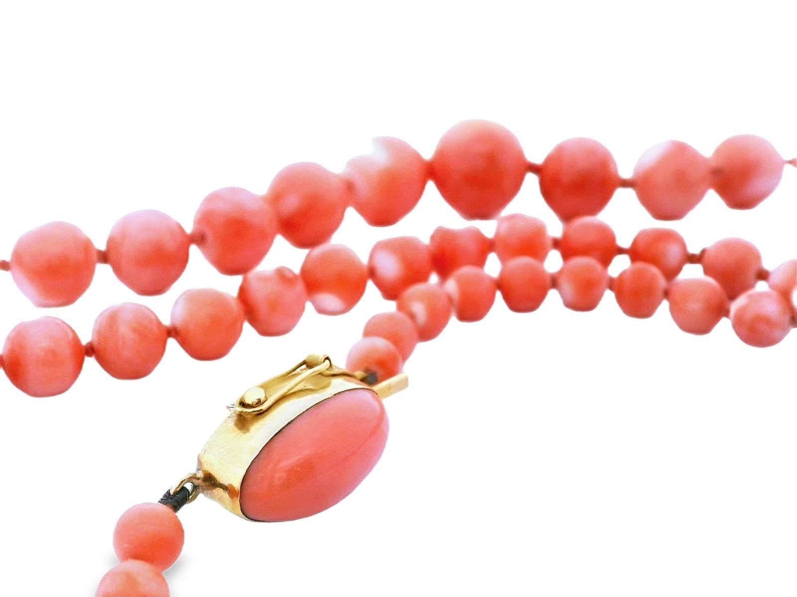 This beautiful necklace is made with 18k yellow gold and coral beads that graduate in size. The necklace is 34 inches in length so it can be worn as a single strand, or doubled up, making this a very versatile necklace that can be styled several
