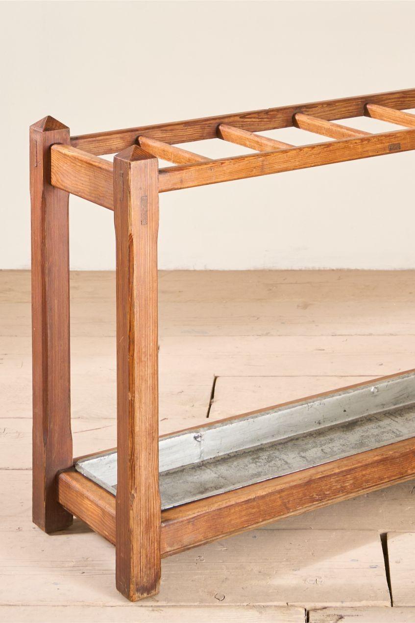 This is a great looking 19th century Pine stick stand. The minimal detail and pale colour means this would sit well in a large number of interiors. The size is neat as well as it is long but narrow so wouldn't dominate a space. Clean overall