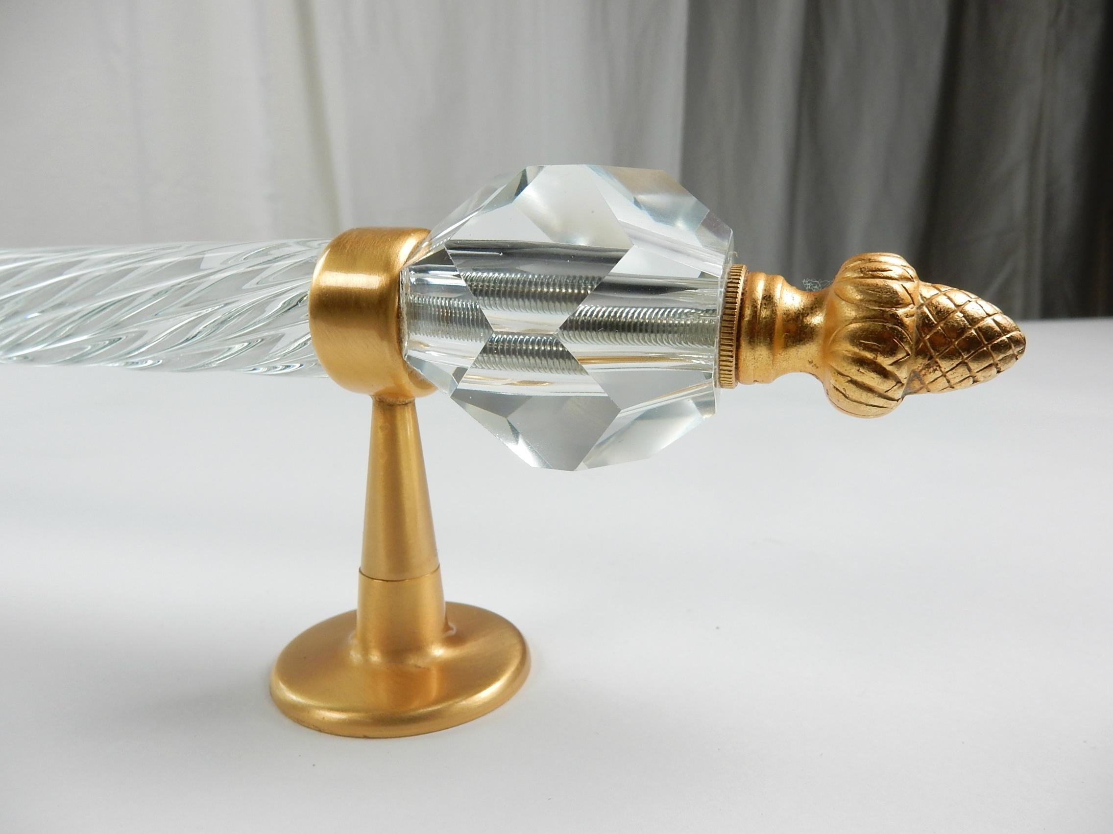 From the Sherle Wagner collection, this gorgeous spiral crystal glass towel bar
with large faceted crystal orbs at each end capped with ornate 22-karat gold plated finial and wall mounts.
31 inches in length, circa 1960s.