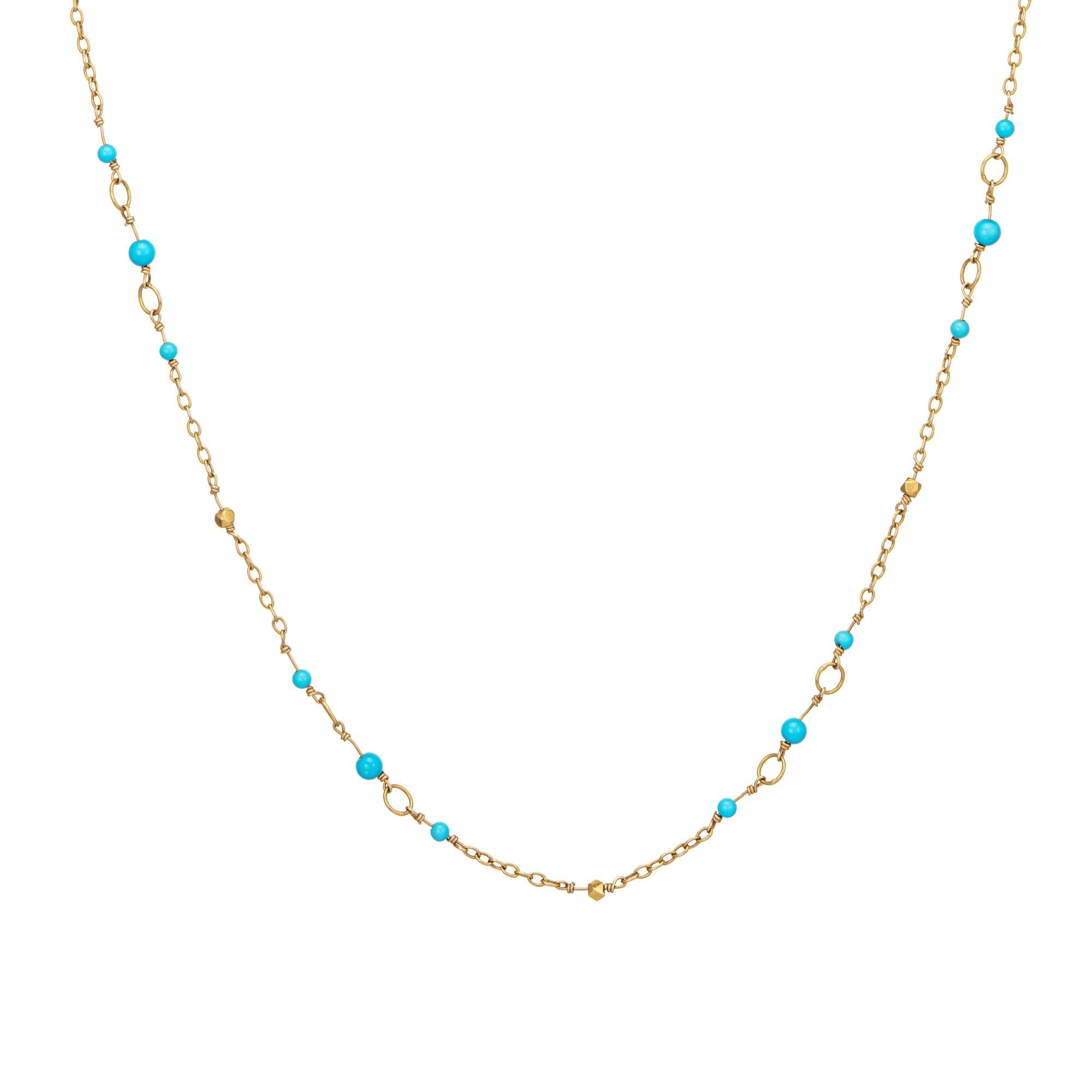 Finely detailed vintage turquoise necklace crafted in 18 karat yellow gold. 

Turquoise beads measure from 2.5mm to 3mm. 
The stylish necklace measures a long 46 inches and is great worn as a long single strand or wrapped as a double strand (and has