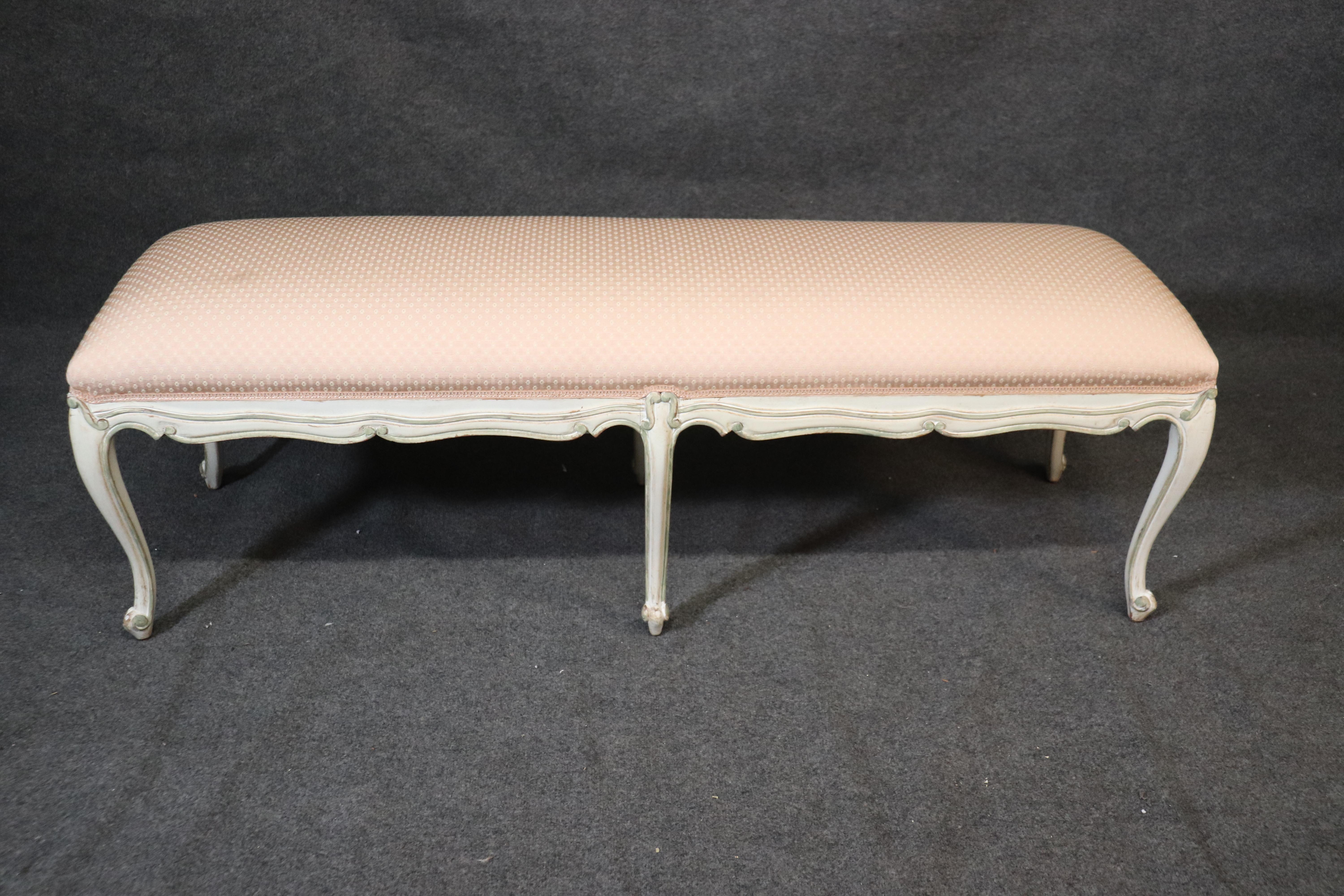 This is a nice French Louis XV painted window bench. There is an old stain on the cushion but it is in otherwise good vintage condition. Dates to the 1960s and measures: 58 wide x 18 deep x 20 inches tall.