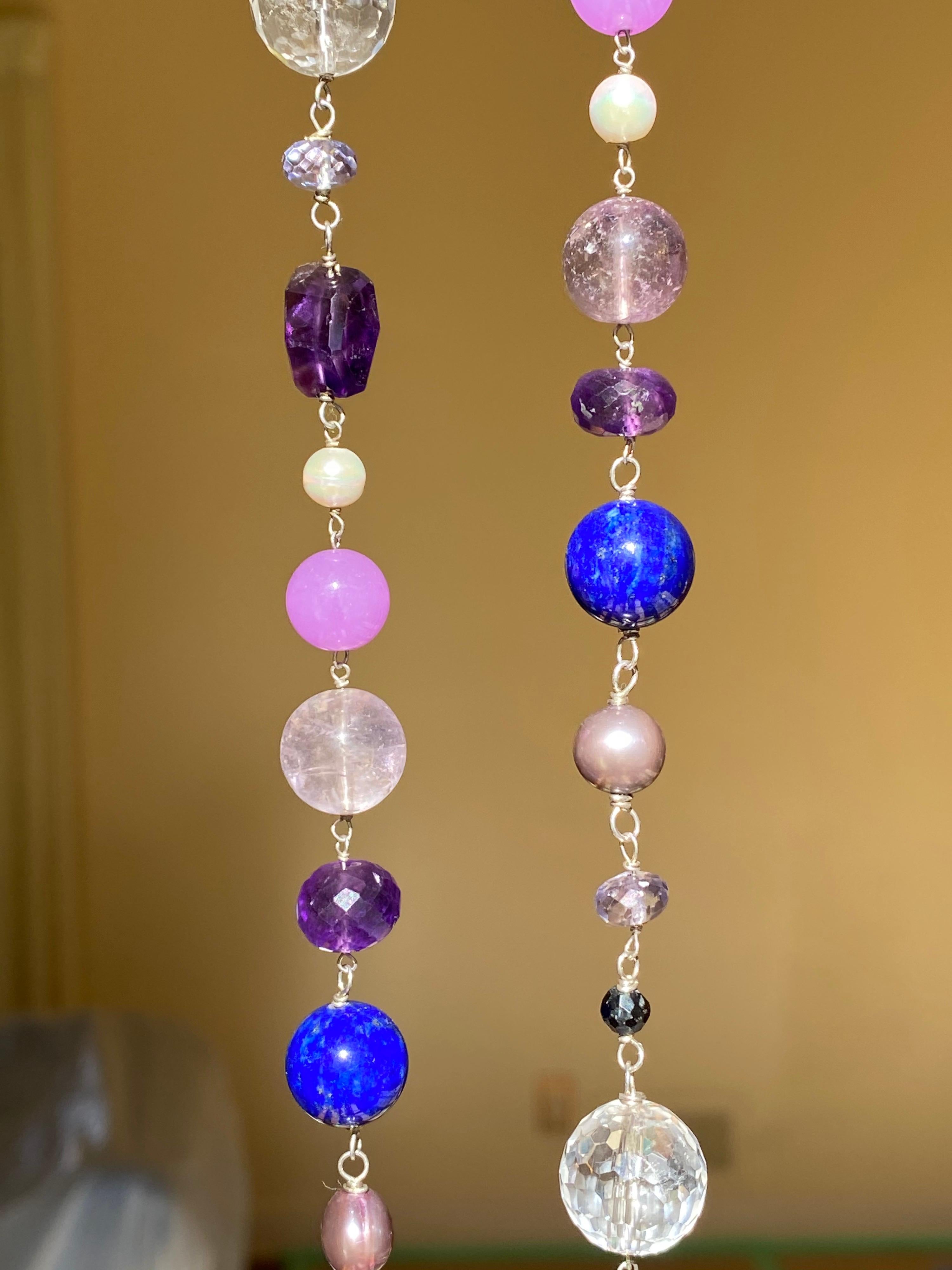 This is from the Great Gatsby Collection from Designer Jane Magon Collections. It's unique and one of a kind measuring 42 inches in length and has hues of purple, pinks, and blues. Each gemstone is individually hand-wire wrapped by the designer.