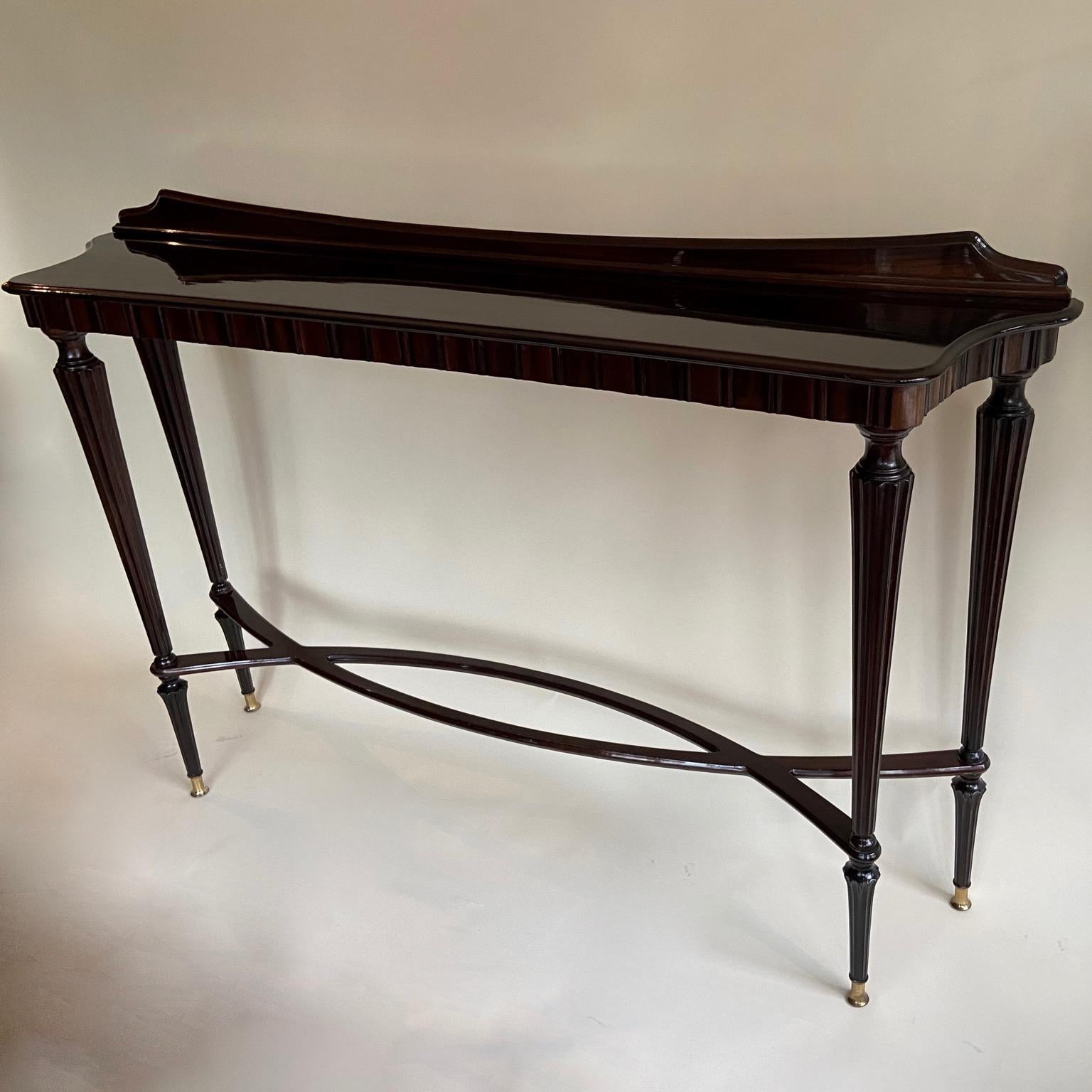 Highly polished long, high and shallow wooden console, most probably by Paolo Buffa, Italy, circa 1940s.
Total height 100cm (approximately 39 inches)
Shelve height 93cm (approximately 36 inches).