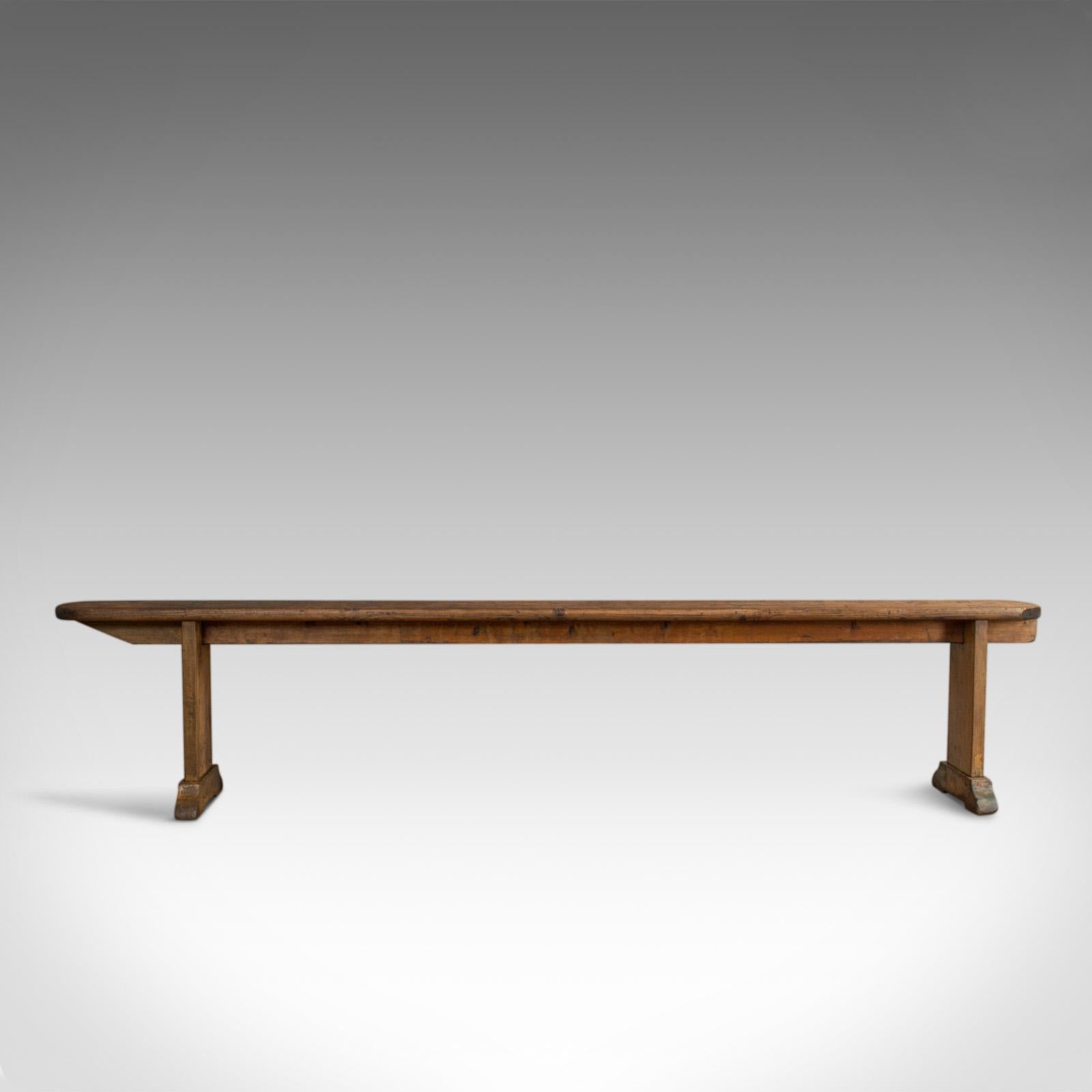 This is a long antique bench. A 7 foot 4 inch, English, Victorian kitchen pew seat dating to the late 19th century, circa 1900.

Rich biscuit hues and fine grain interest
Displaying a desirable aged patina with a warm, tactile surface
Generously
