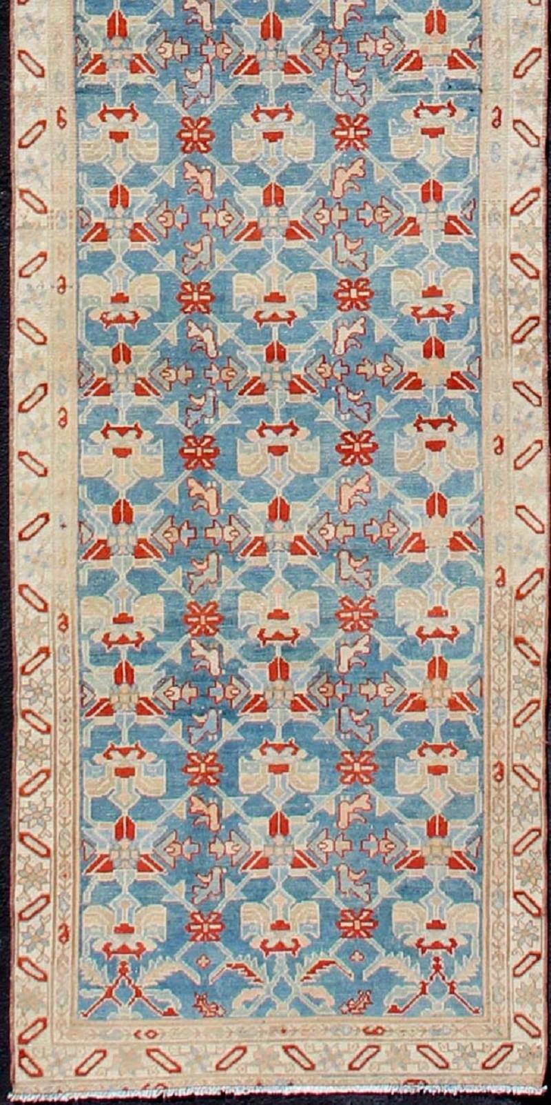 Blue, red, and nude Antique Malayer long runner from Persia with all-over repeating design, rug sk-7467, country of origin / type: Iran / Malayer, circa 1910.l

This magnificent antique Persian Malayer long runner (circa 1910) bears a beautiful,