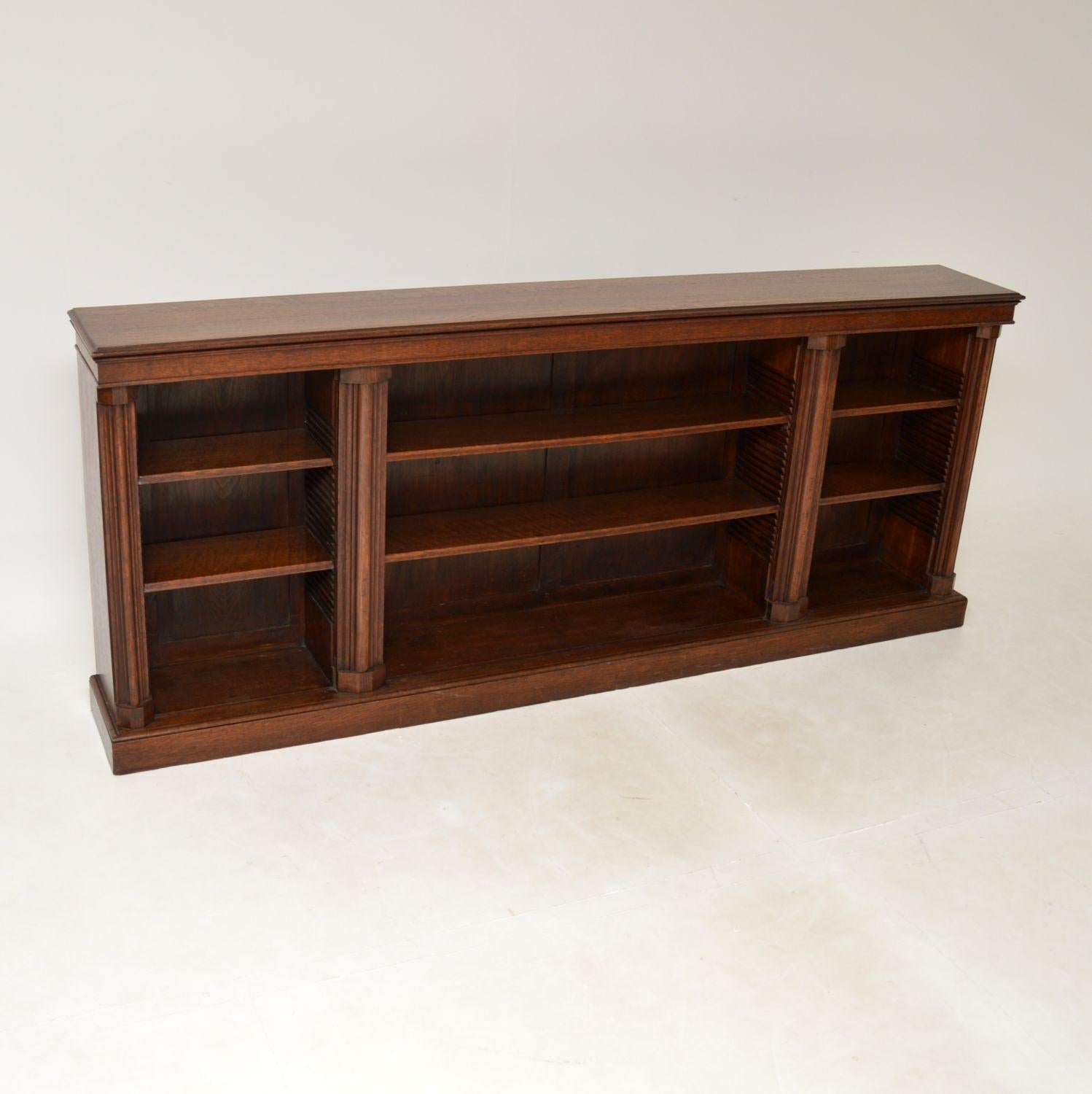 A superb & long antique Victorian solid oak bookcase of the highest order. This was made in England, it dates from around the 1880-1890’s period.

The quality is absolutely amazing, this is large, extremely well made and very heavy. The shelves