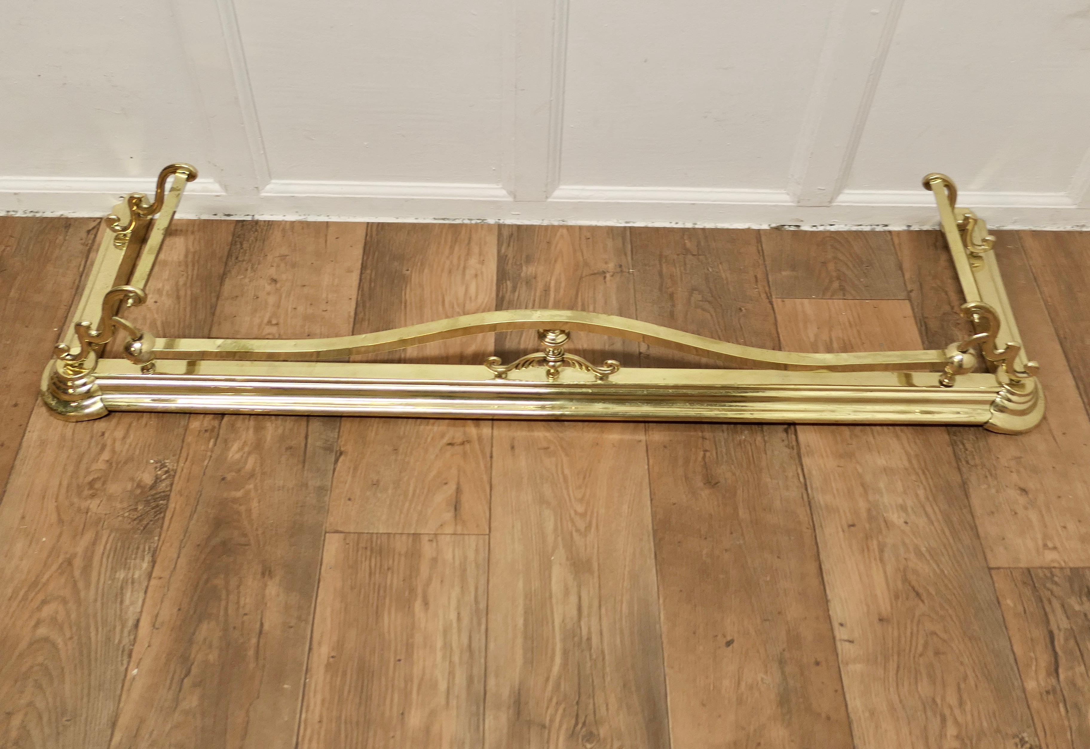 Late 19th Century Long Art Nouveau Brass Fender  This is a Beautifully Designed Victorian Fender For Sale